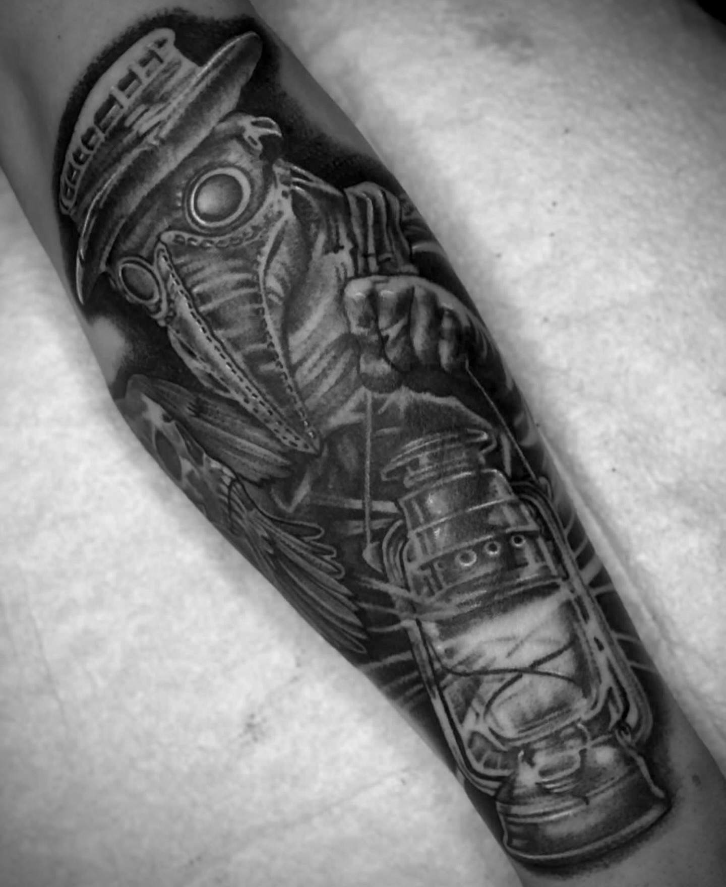 Diver with lantern realism tattoo on the forearm by Big Steve Lewis