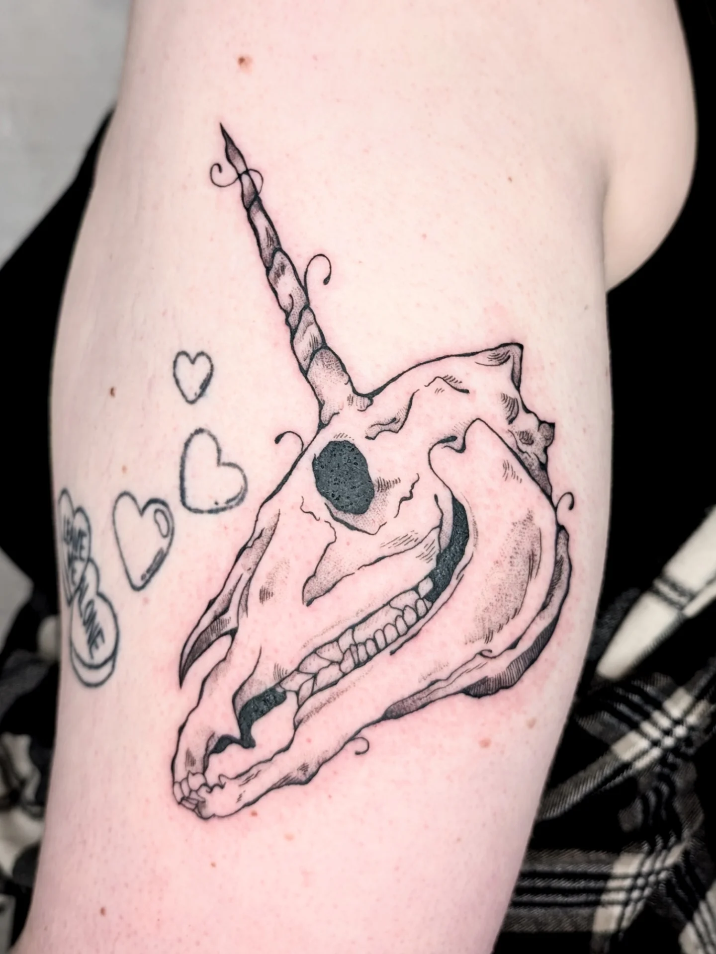 Unicorn skull black and grey tattoo on the forearm by mila