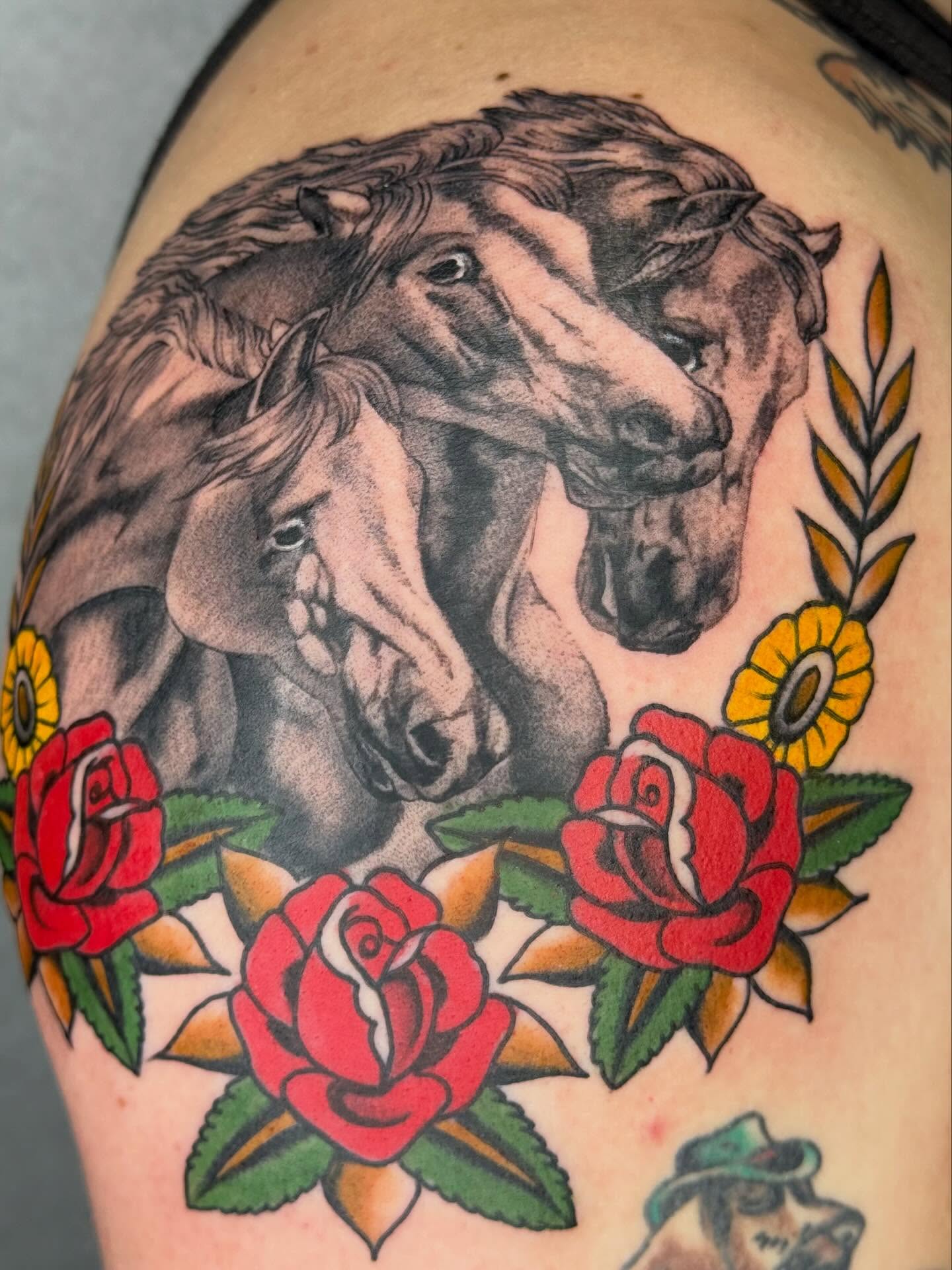 Horses and roses American traditional tattoo on the shoulder by Sarah Christine Tattoo, Calgary, Alberta