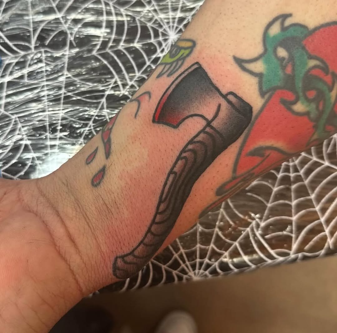 Axe American traditional tattoo on the forearm by norawillstattoo