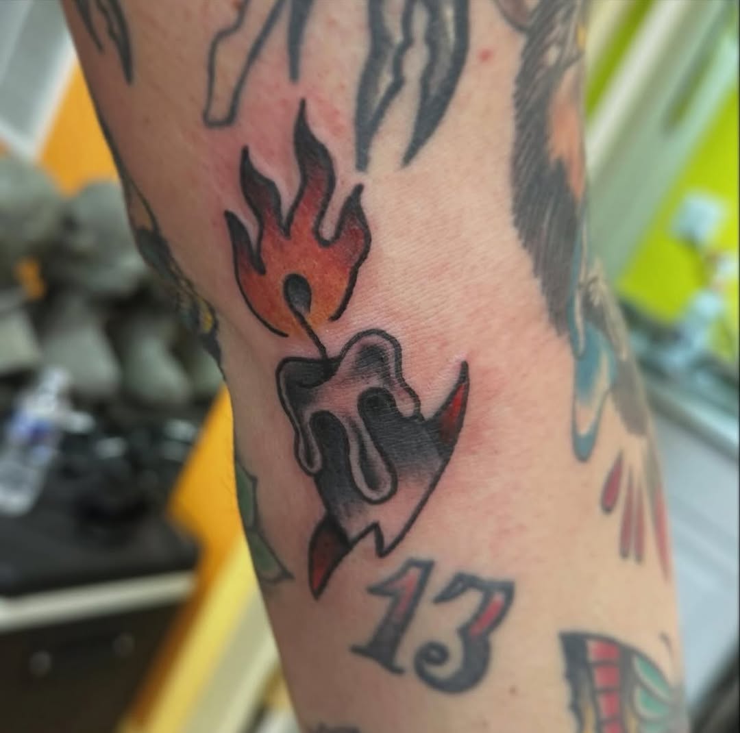 Burning candle American traditional tattoo on the forearm by norawillstattoo