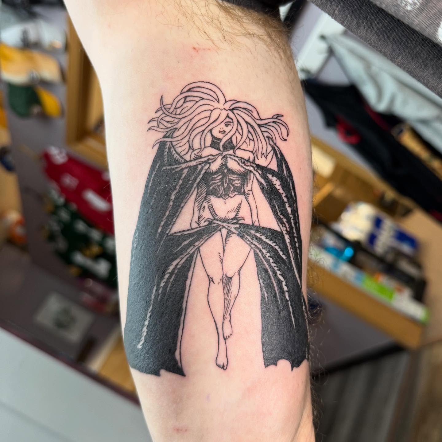 Winged woman black and grey tattoo on the forearm by Hunter Beyer