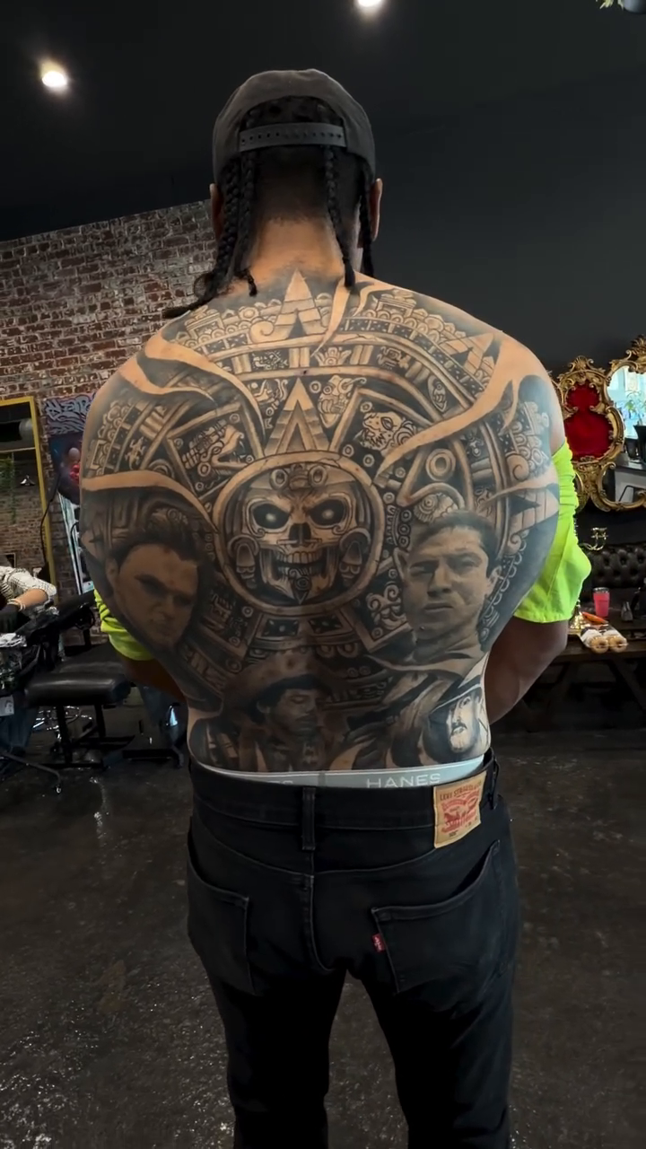 Aztec calendar back piece Chicano tattoo on the back by Bernie calderon, Fresno, California