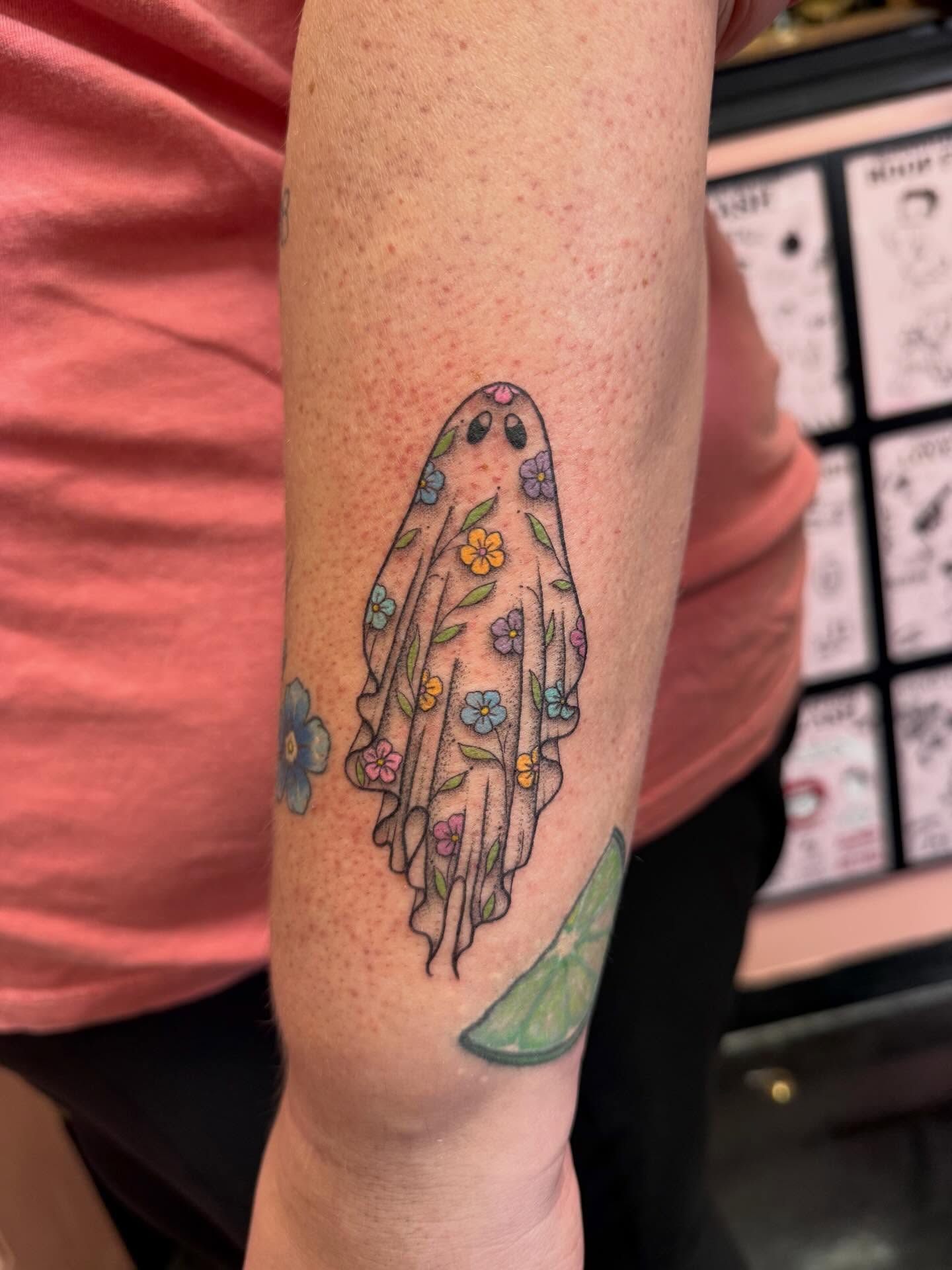 Ghost with flowers watercolor tattoo on the forearm by Jennylee Aerts, Asbury Park, New Jersey