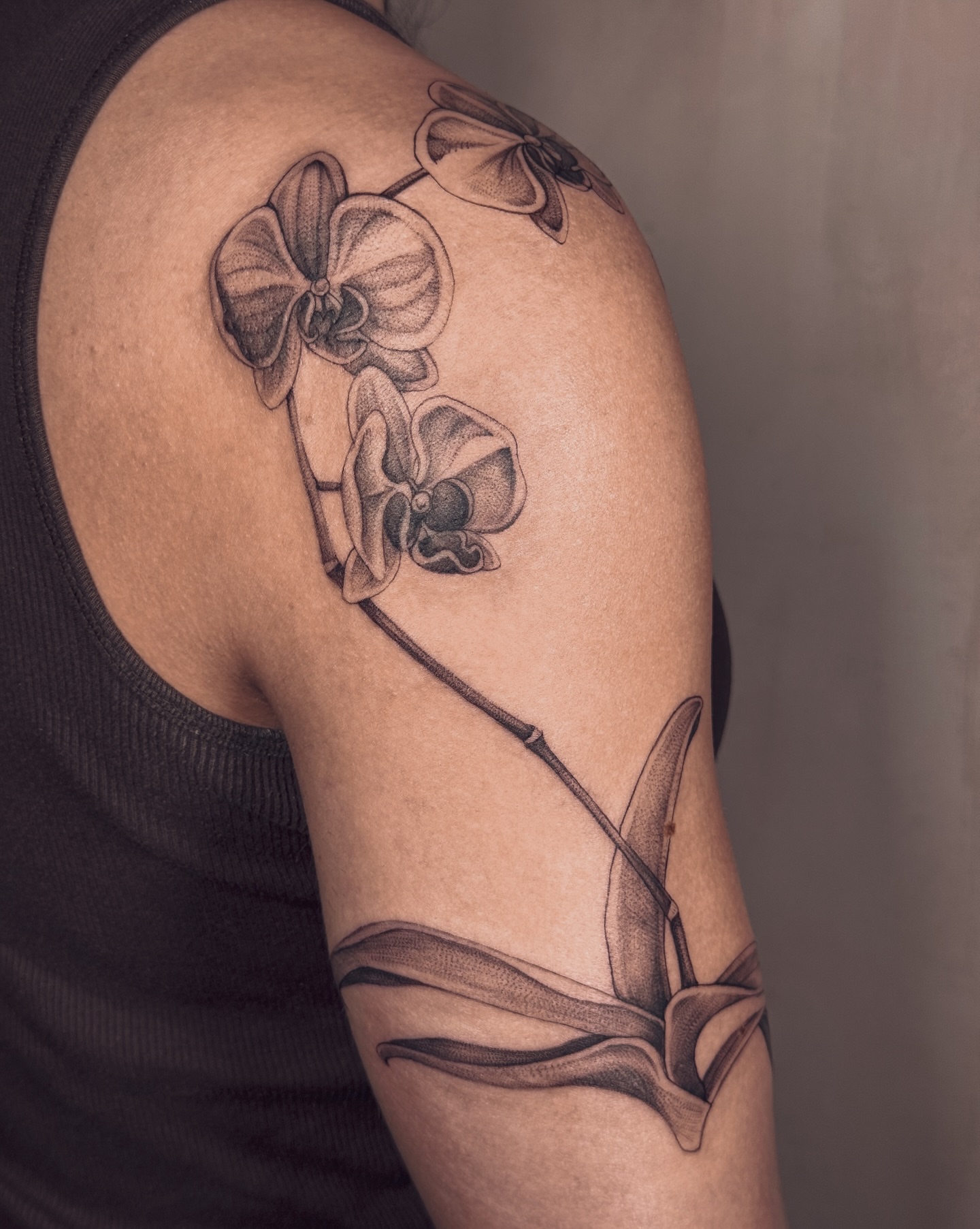 Orchid black and grey tattoo on the shoulder by Floral