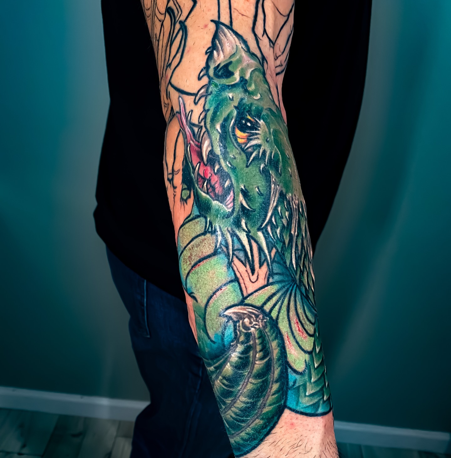 Monster realism tattoo on the forearm by Eric James, Phoenix, Arizona