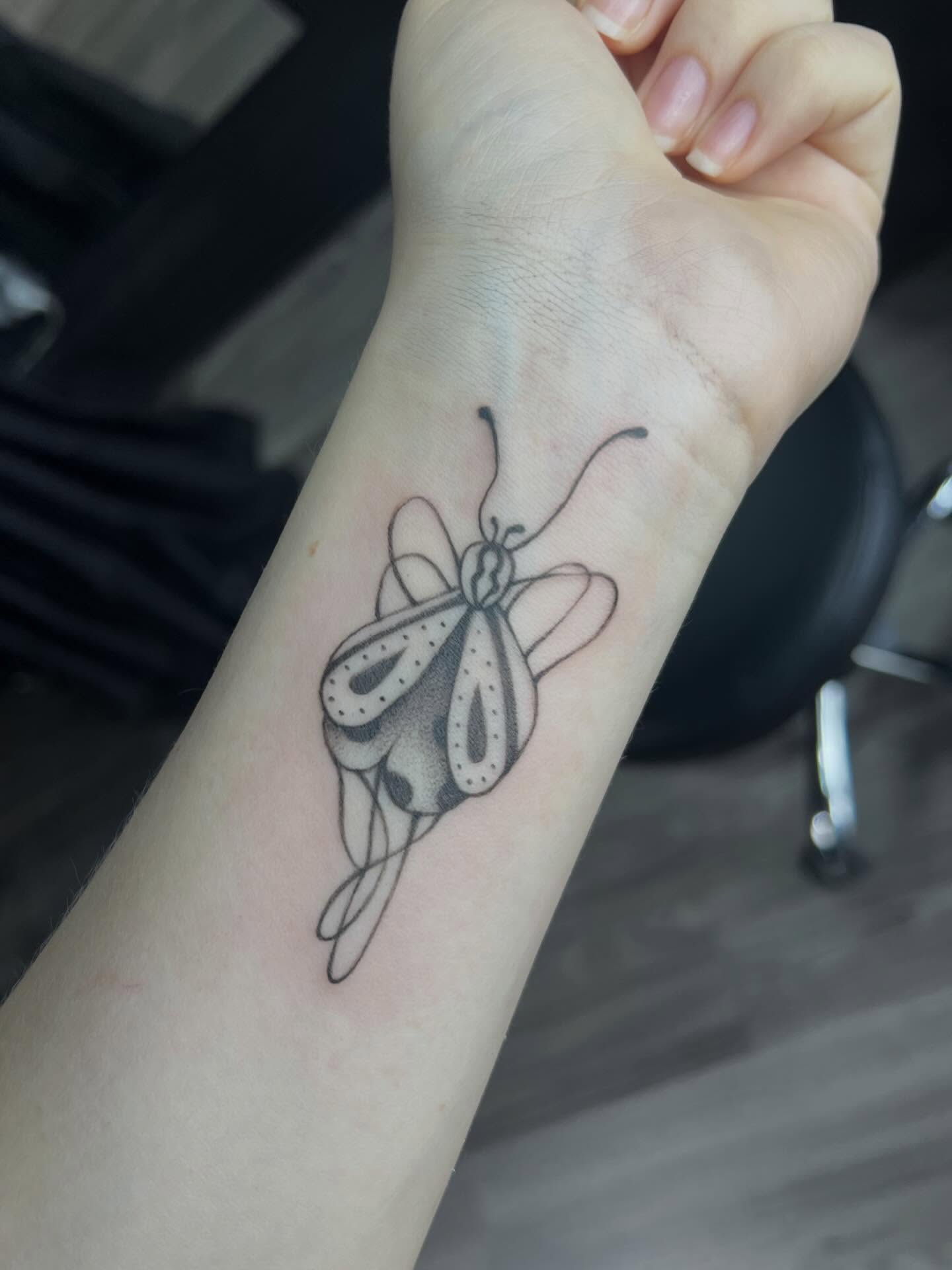 Butterfly dotwork tattoo on the forearm by Haiiitattoo