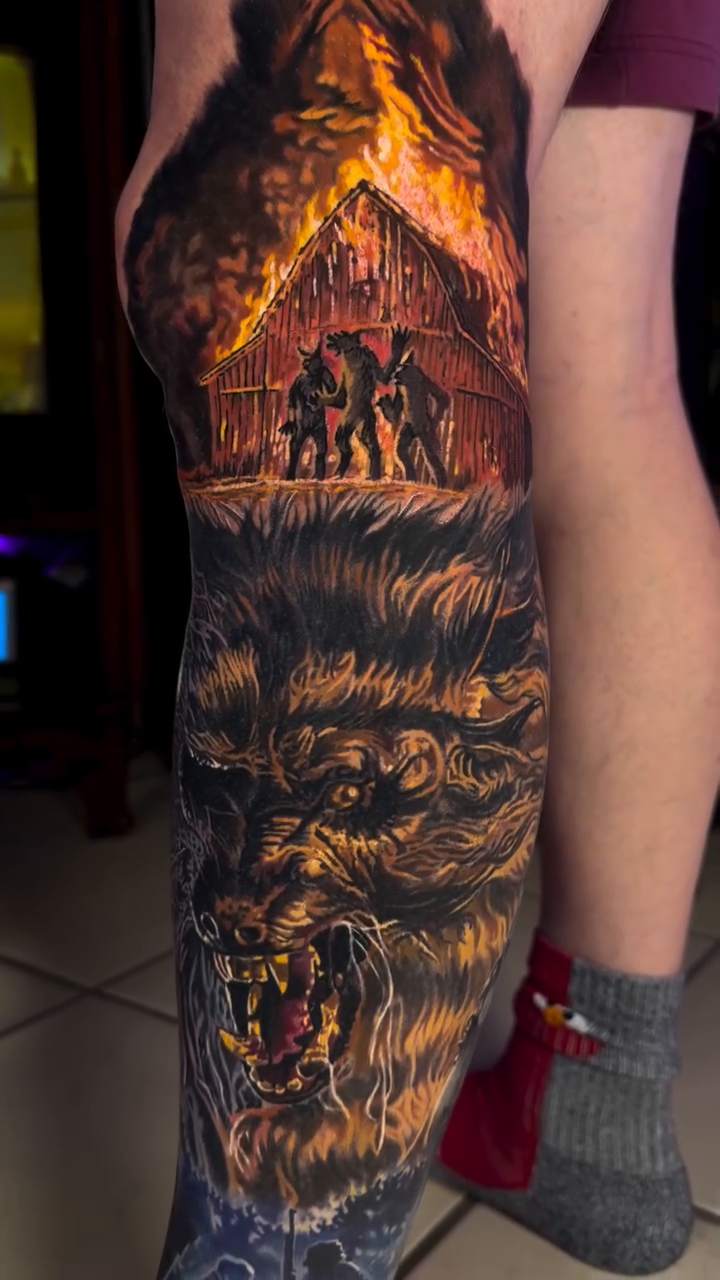 Werewolf and burning cabin scene realism tattoo by Steven Pelkey, Eastpointe, Michigan