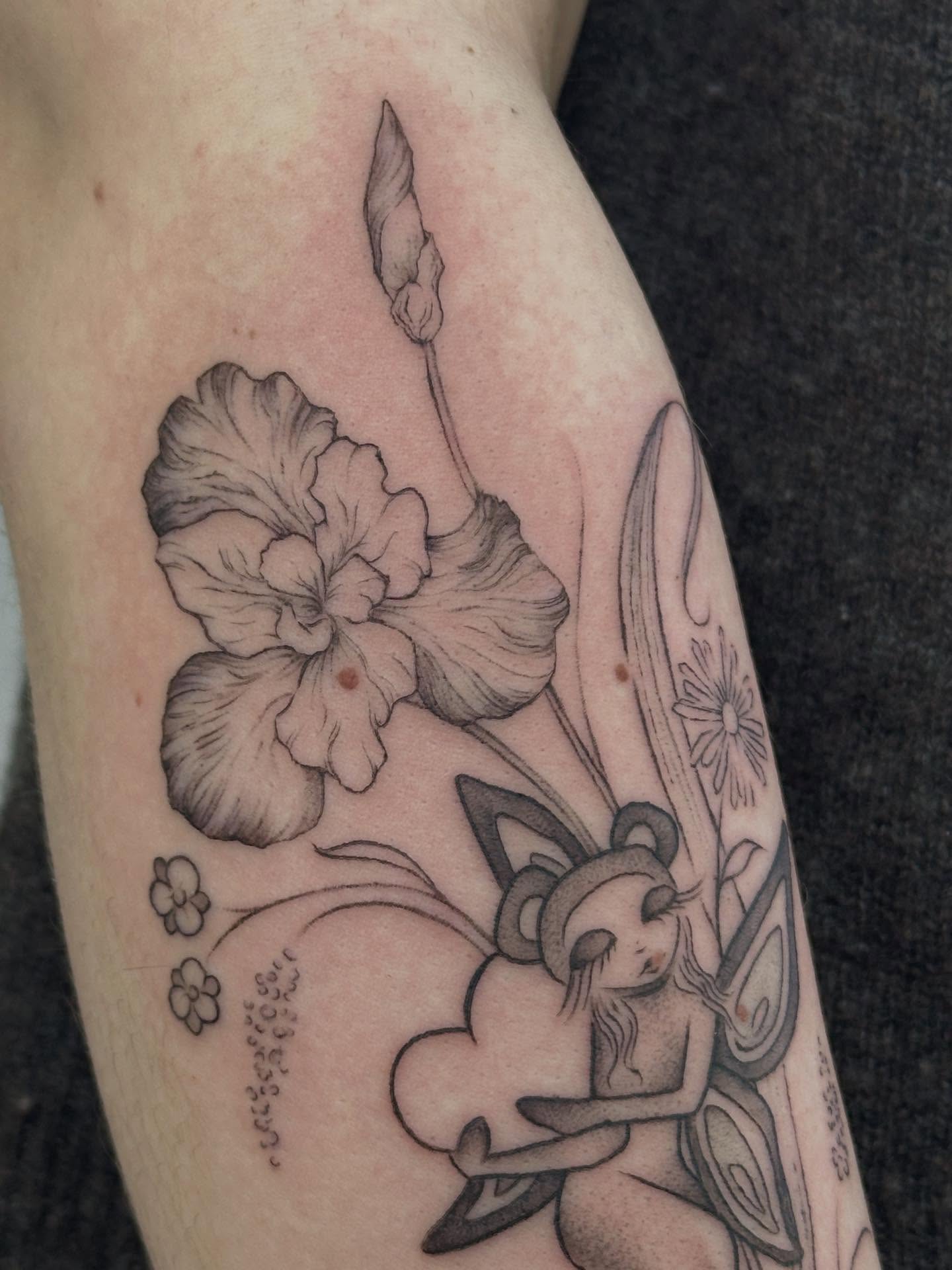 Fairy and iris black and grey tattoo on the forearm by gabrielle rosemary ποΈ