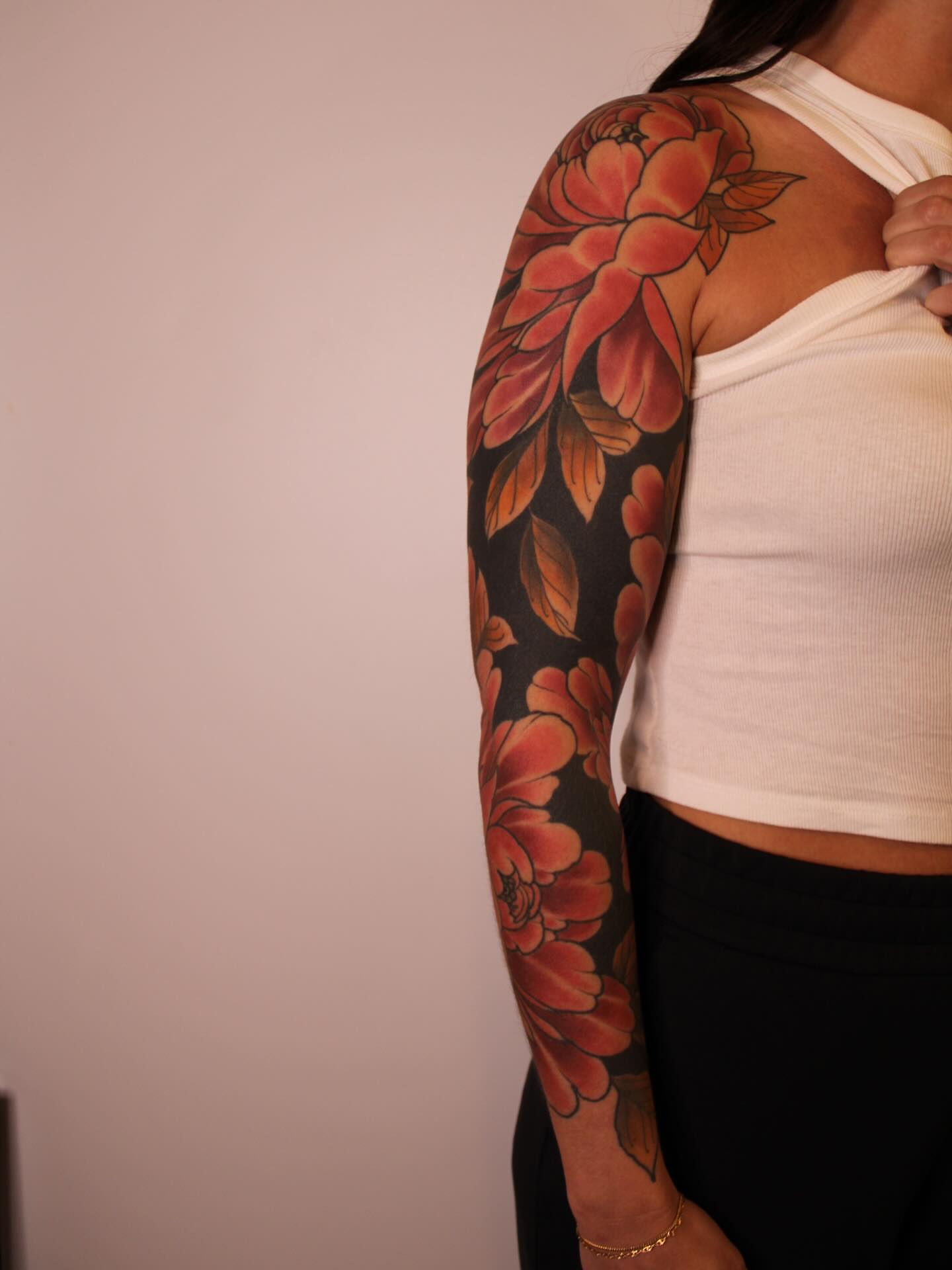 Floral bouquet realism tattoo on the upper arm by Samantha Compasso Ford