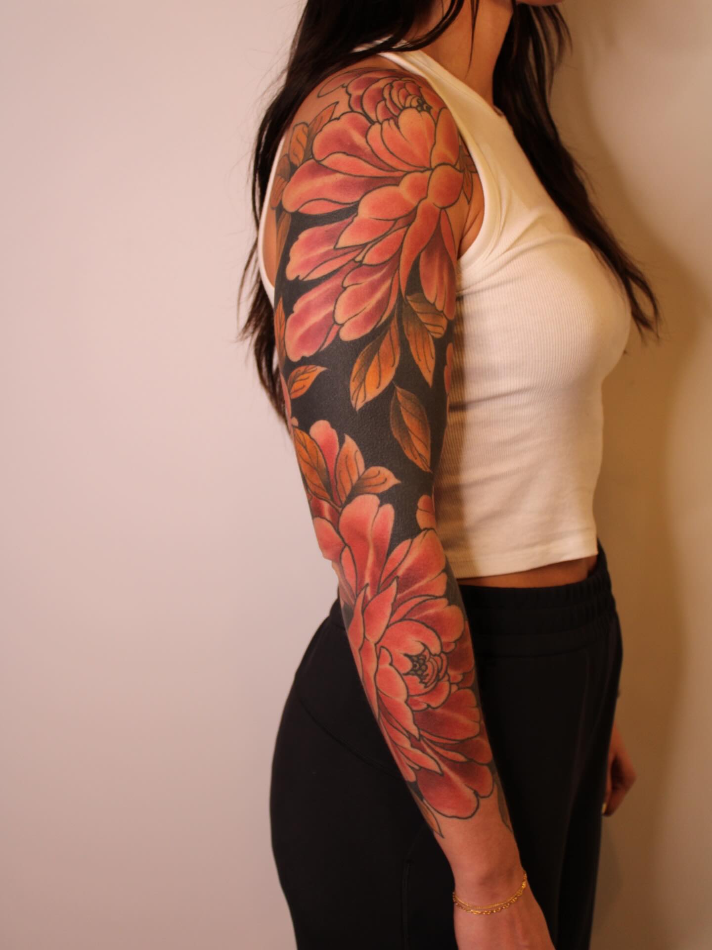 Floral sleeve realism tattoo on the upper arm by Samantha Compasso Ford