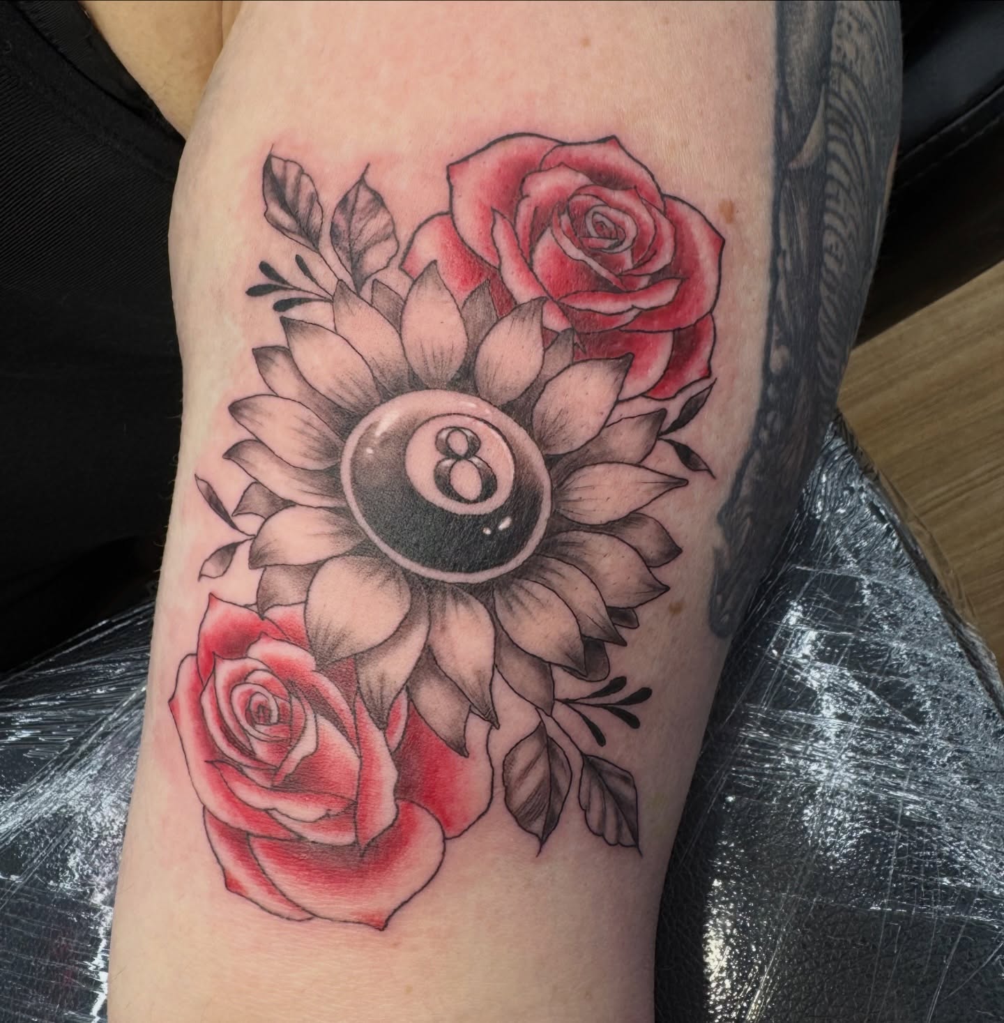 Roses and eight ball American traditional tattoo on the forearm by Celia