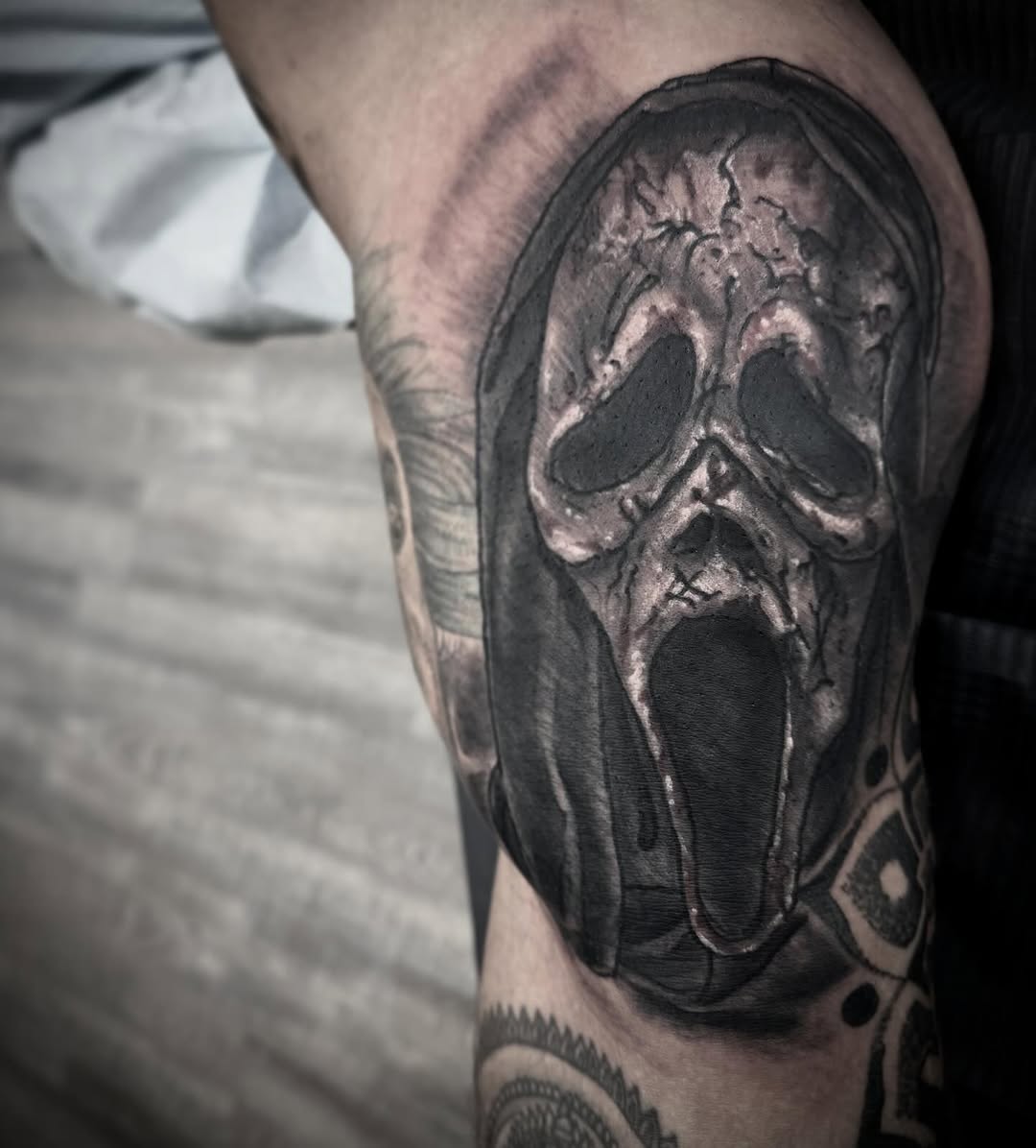 Ghostface mask realism tattoo on the forearm by Alec Bauer