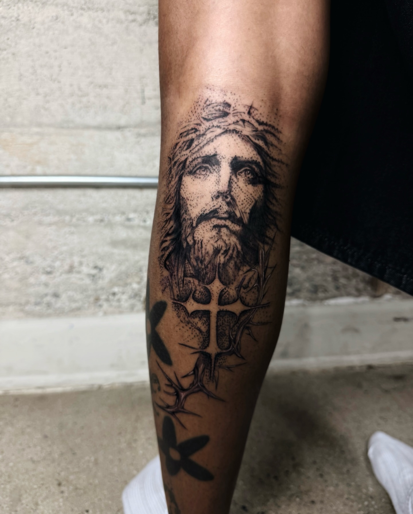 Religious figure dotwork tattoo on the forearm by viktoria raquel