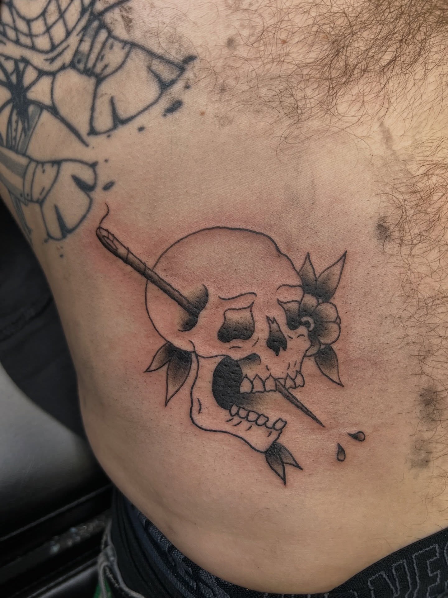 Skull with cigarette black and grey tattoo on the ribs by Palmer Andrist🩸Fort Collins Tattoo Apprentice