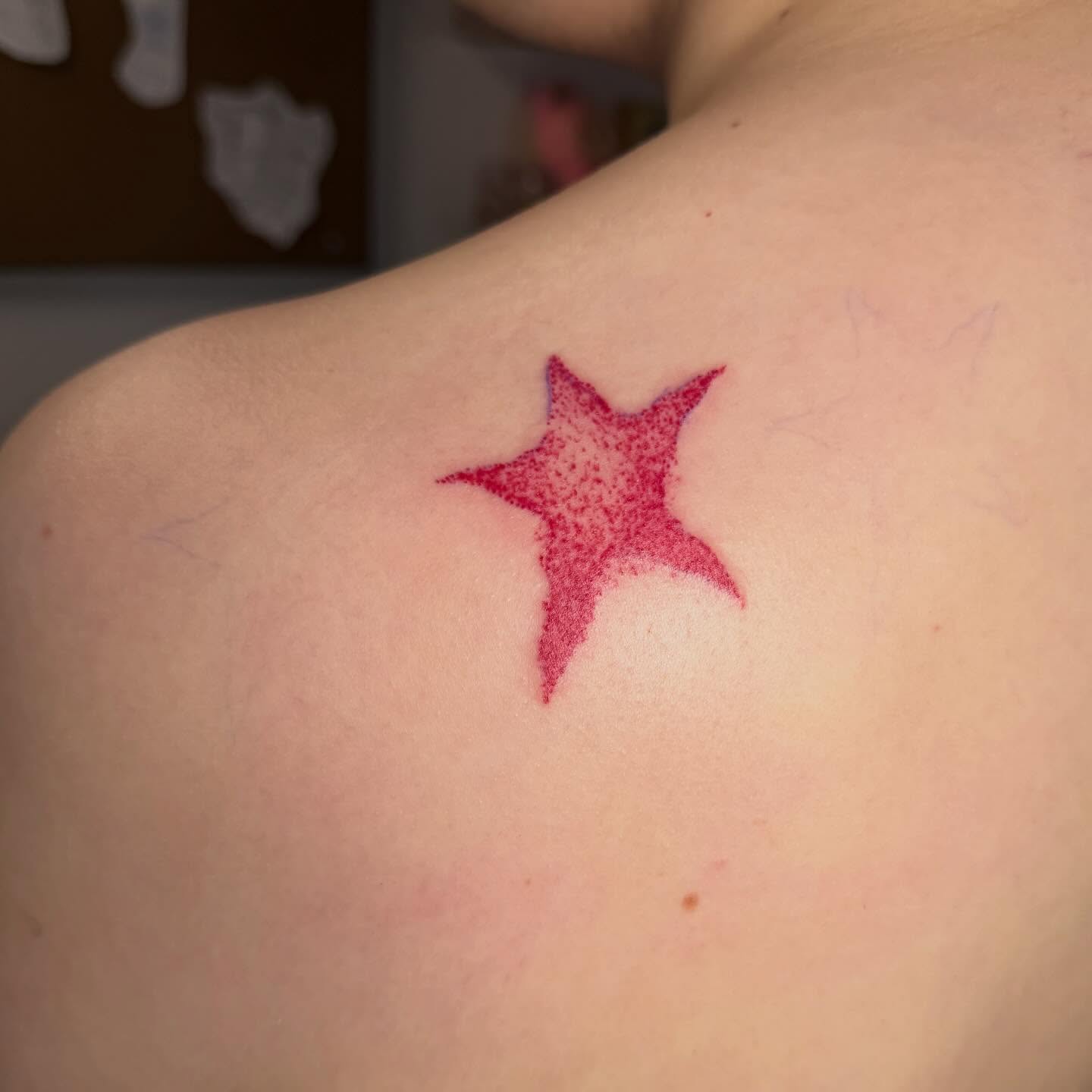Star dotwork tattoo on the shoulder by Abby