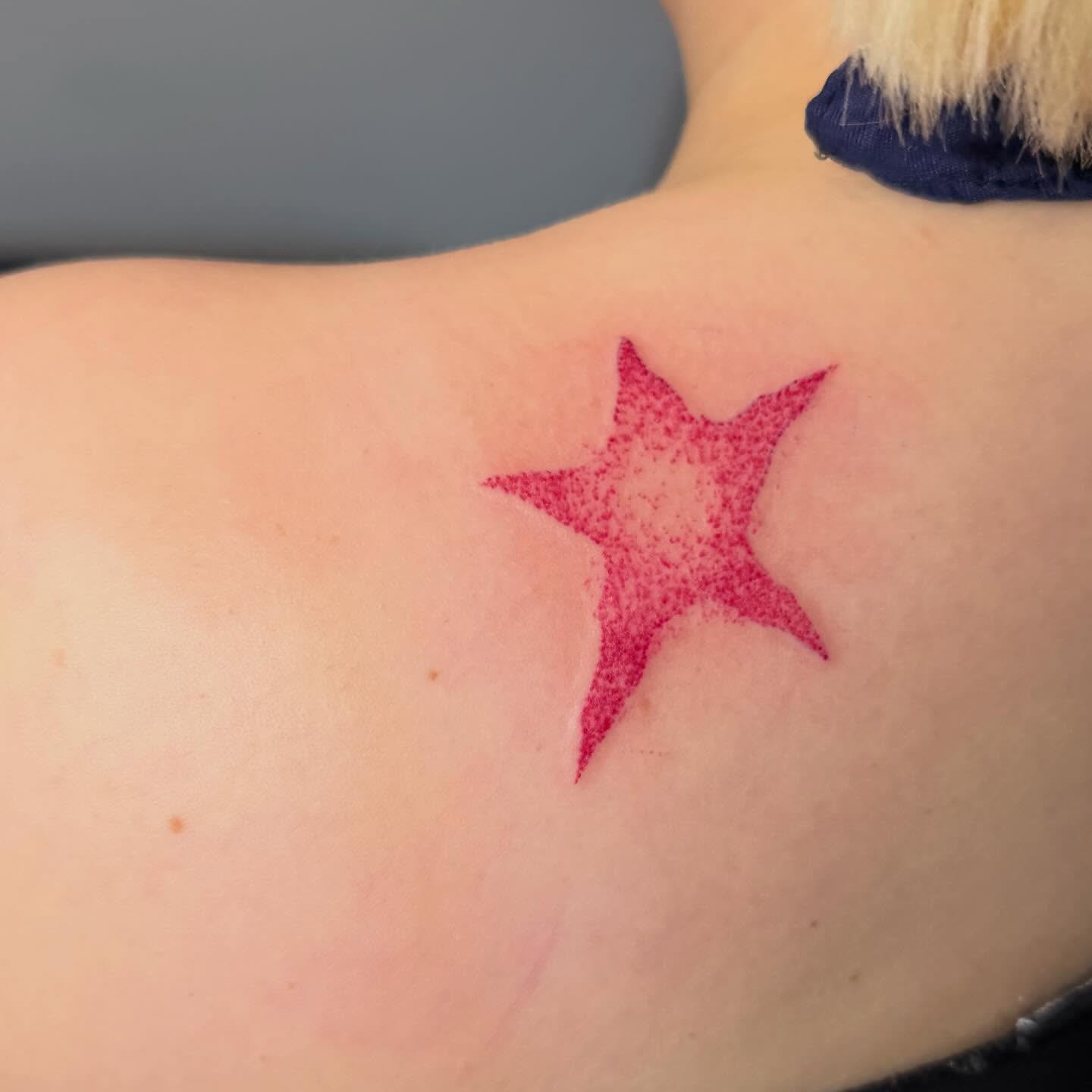 Star dotwork tattoo on the back by Abby