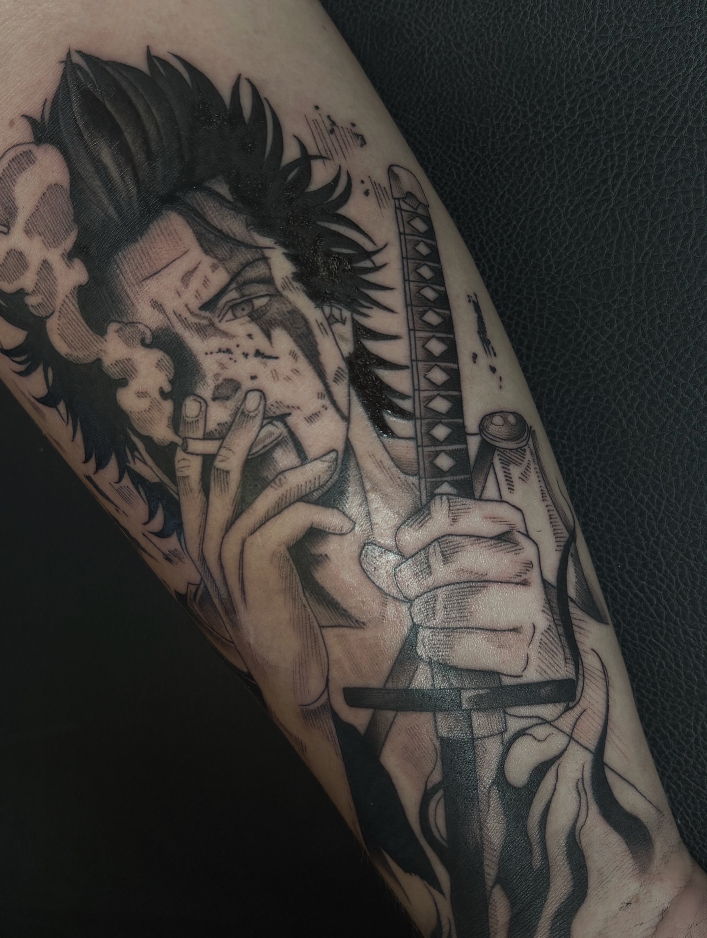 Man smoking black and grey tattoo on the forearm by Fine Line Tattoo Artist