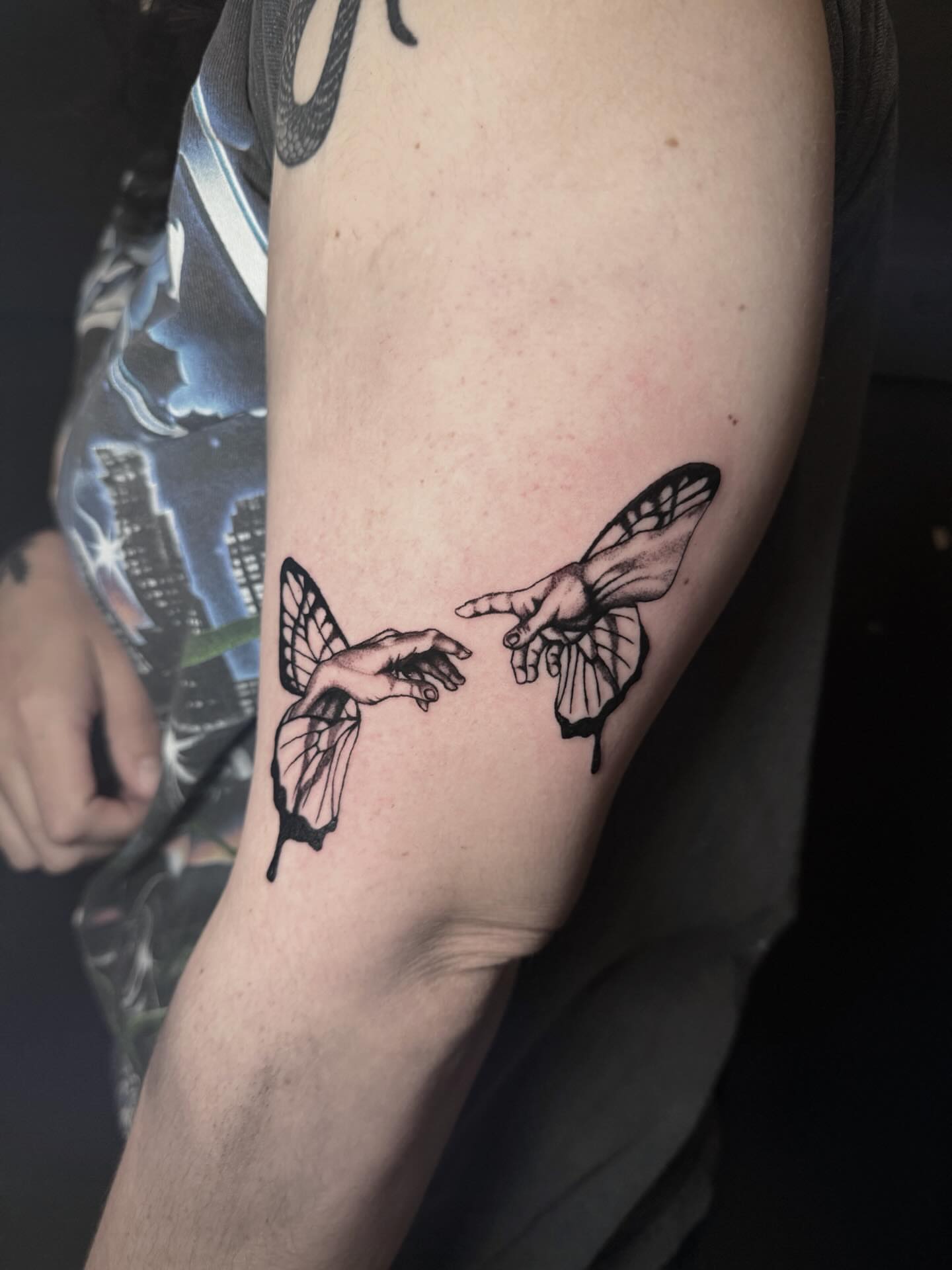 Creation moment surrealism tattoo on the forearm by Jess, Midvale, Utah