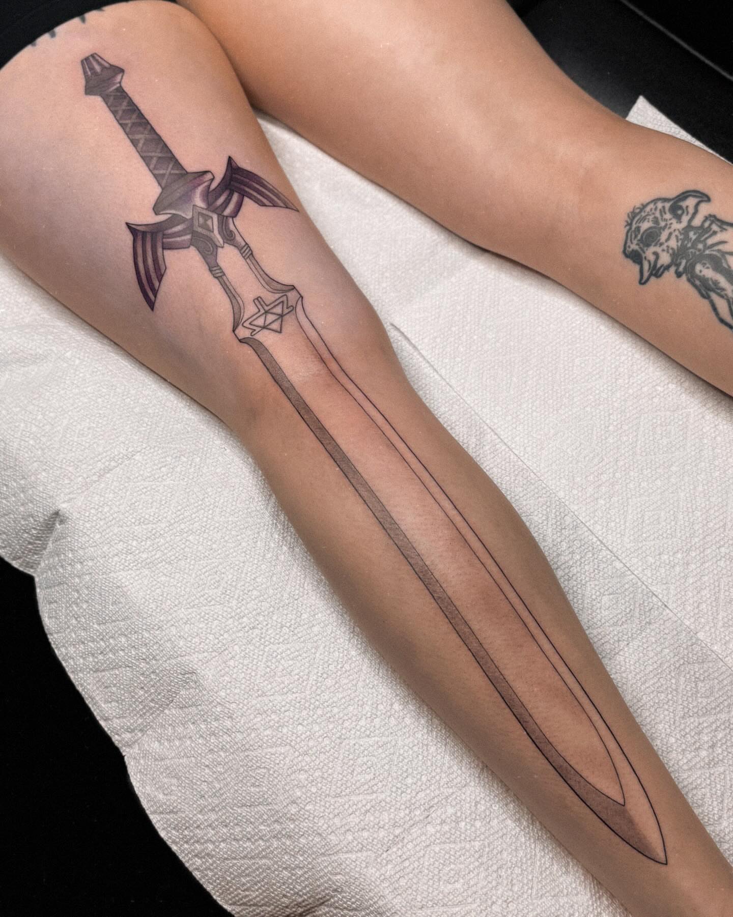 Sword black and grey tattoo on the forearm by 𝔍𝔞𝔯𝔢𝔡 𝔞𝔩𝔩𝔢𝔫
