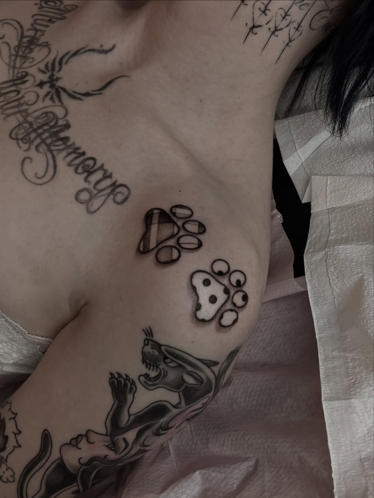 Paw prints dotwork tattoo on the chest by Silvia :)