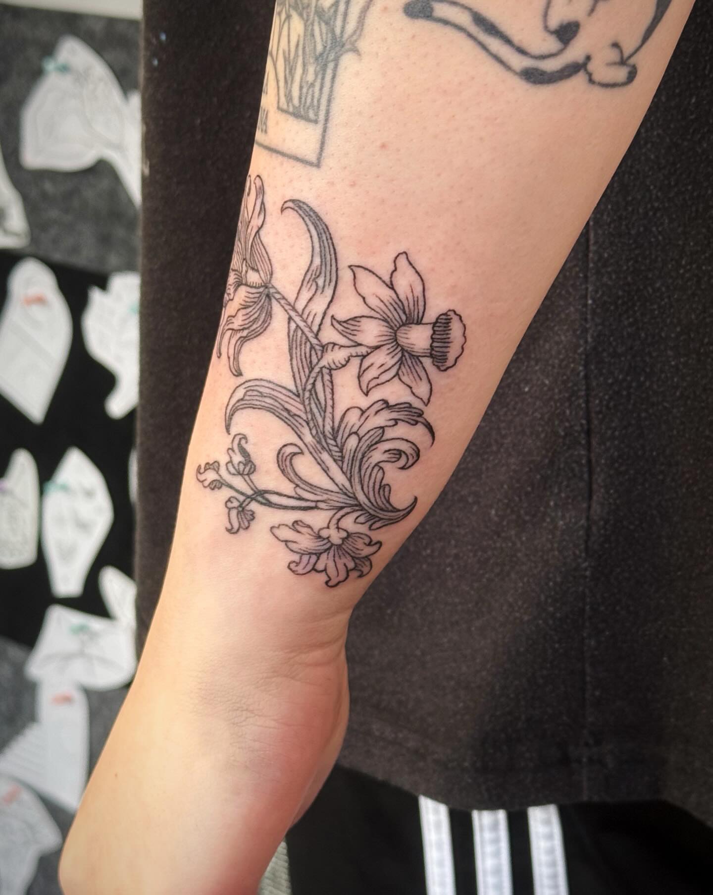 Lilies black and grey tattoo on the forearm by Luna Enriquez⚡️, Portland, Oregon