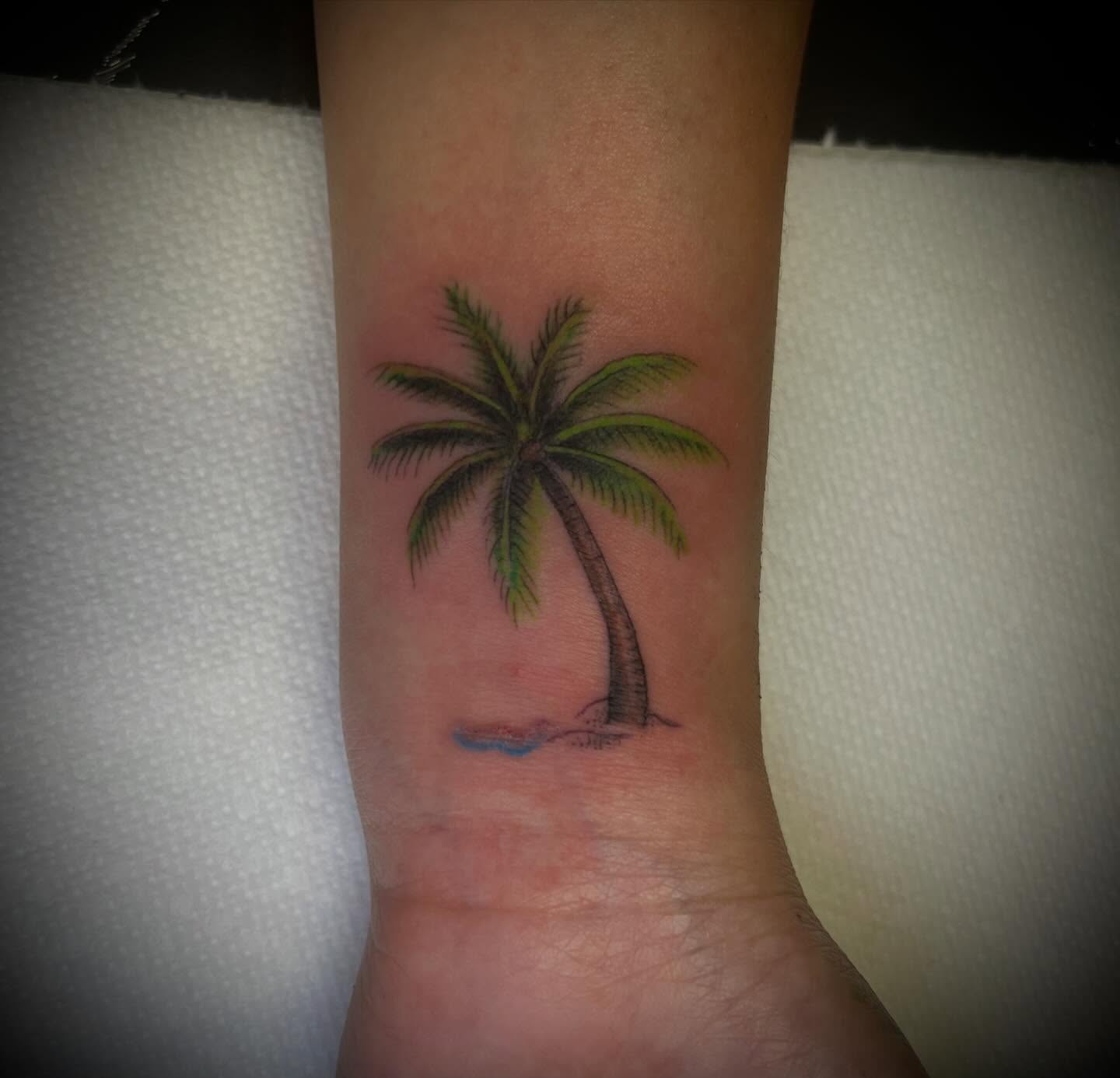 Palm tree realism tattoo on the forearm by James Richardson