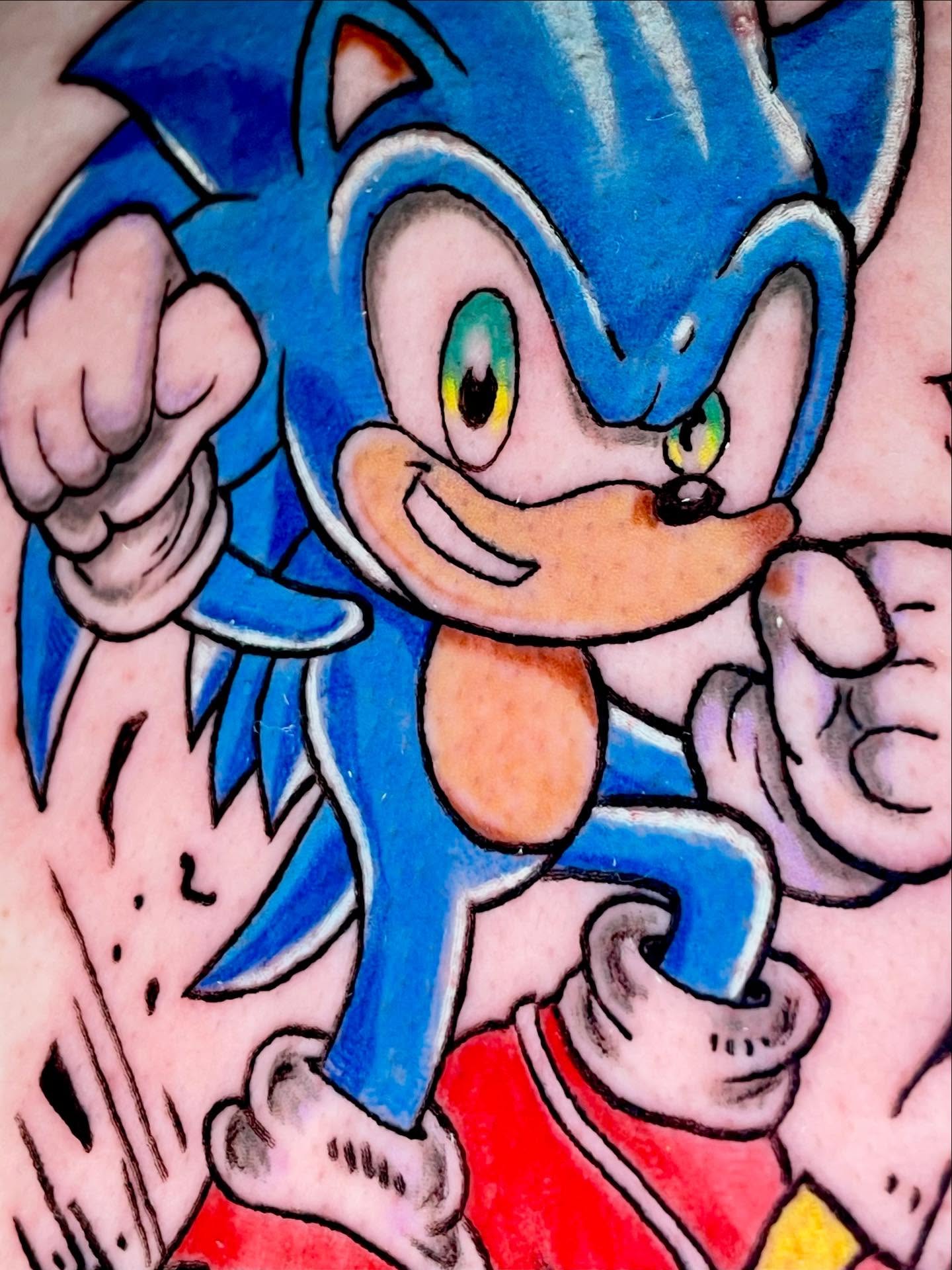 Sonic the Hedgehog American traditional tattoo on the forearm by ๐ท๐ซKevan๐๐ท