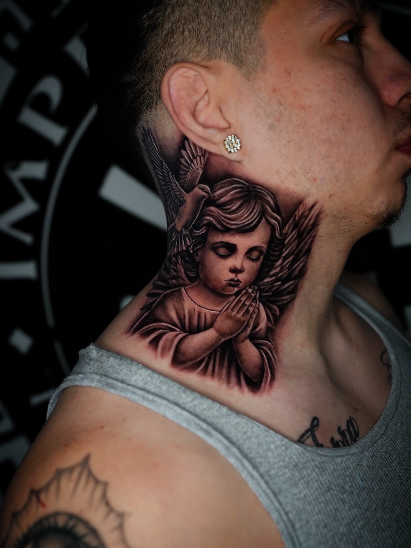 Praying angel realism tattoo on the neck by Dreamchaserink