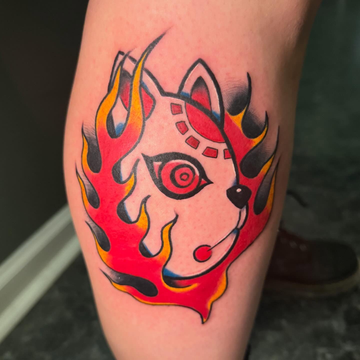 Demon mask dotwork tattoo on the thigh by Kodi Green