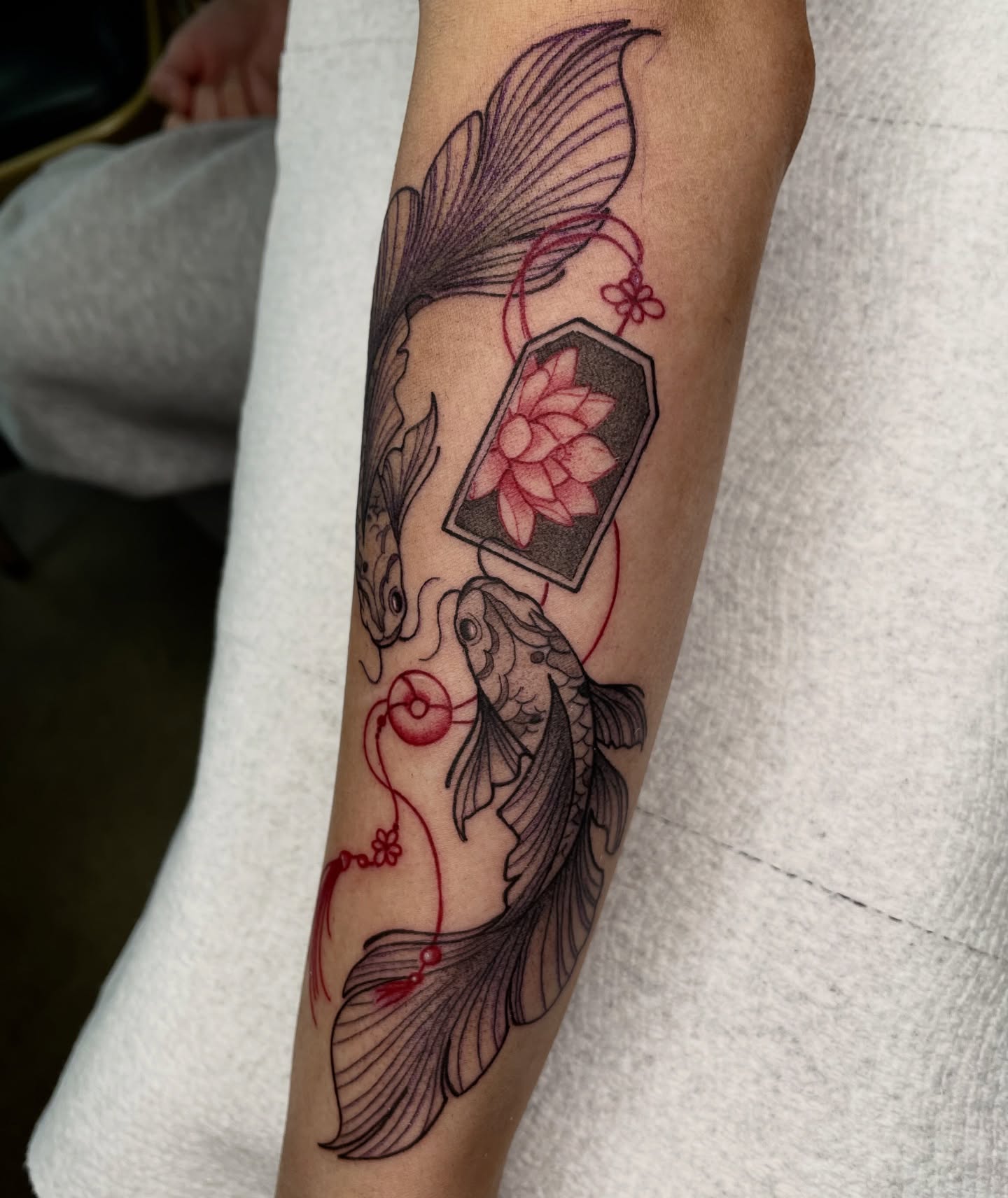 Koi fish and lotus japanese irezumi tattoo on the forearm by Ducky