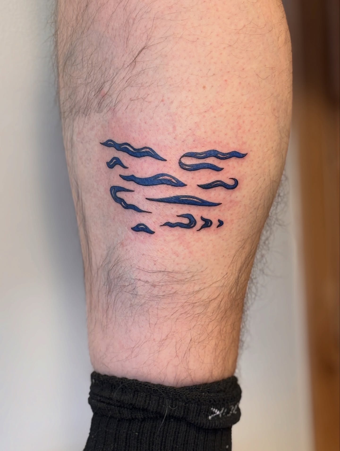 Waves geometric tattoo on the forearm by Maddie