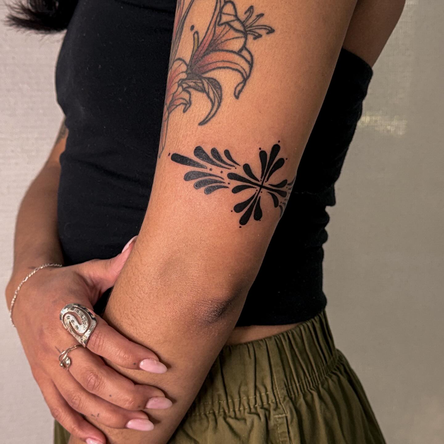 Lily and abstract pattern dotwork tattoo on the forearm by Las Vegas Tattoo Artist