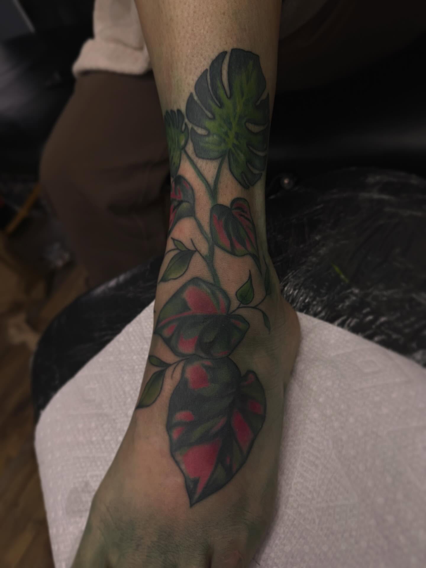 Monstera leaves American traditional tattoo on the foot by Waylen Foster