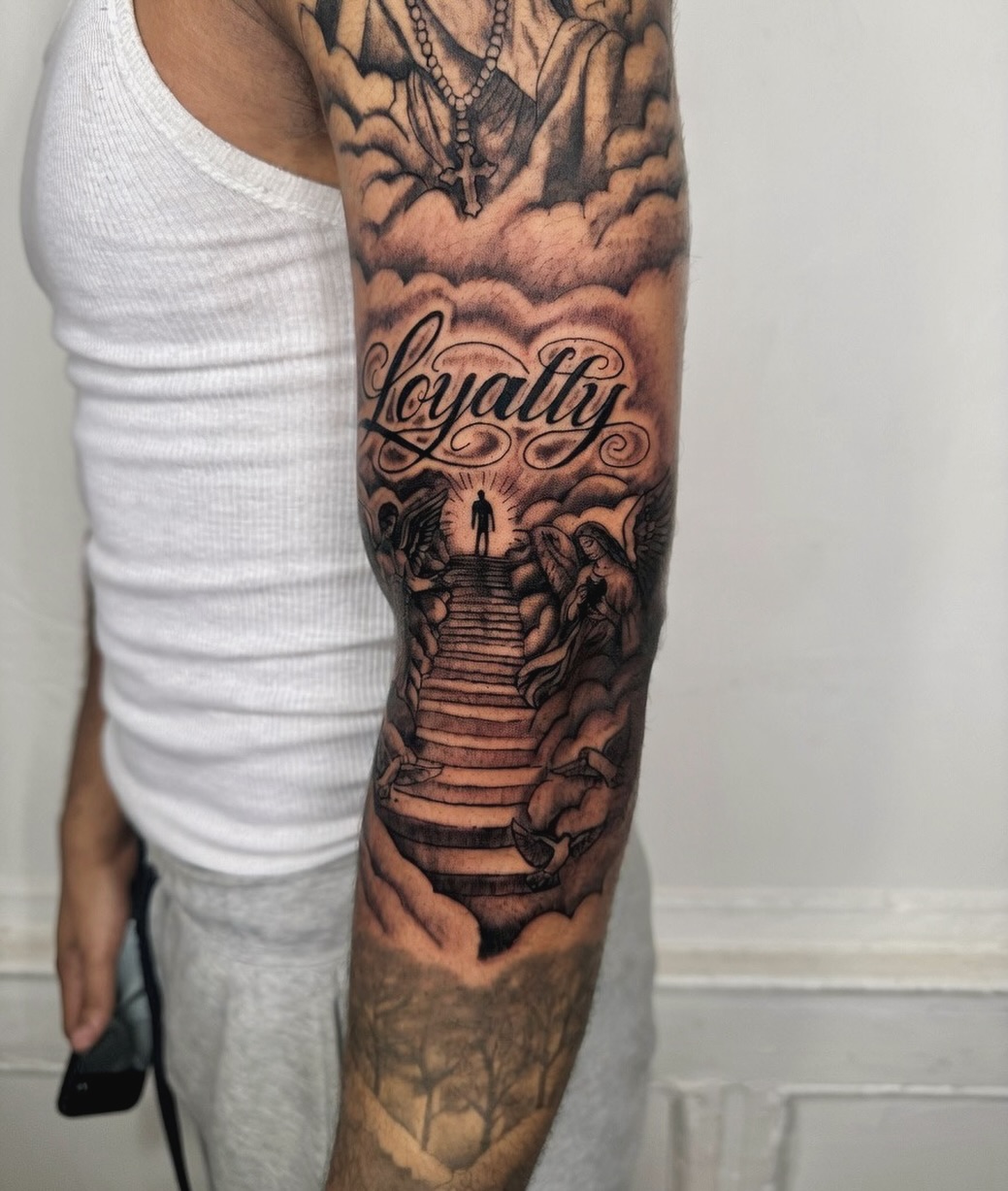 Stairway to heaven with loyalty script Chicano tattoo on the forearm by JayyeSosa