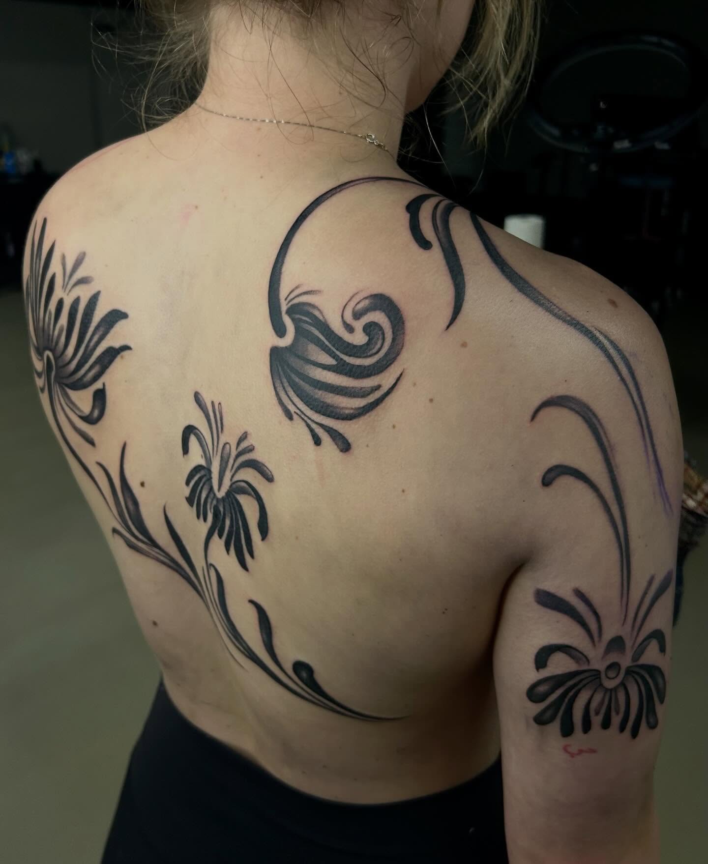 Floral design black and grey tattoo on the back by Haleigh Cunningham, Charlotte, North Carolina