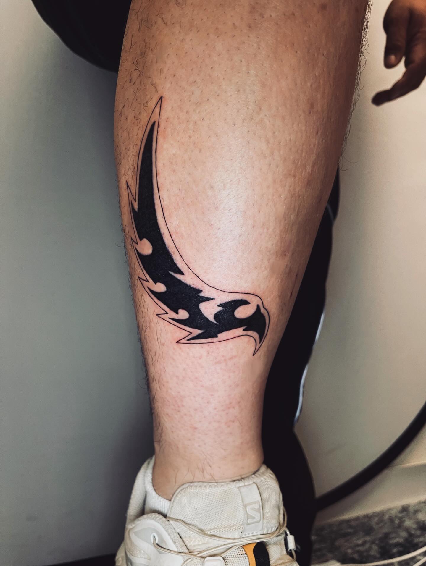 Flame tribal tattoo on the calf by vivian