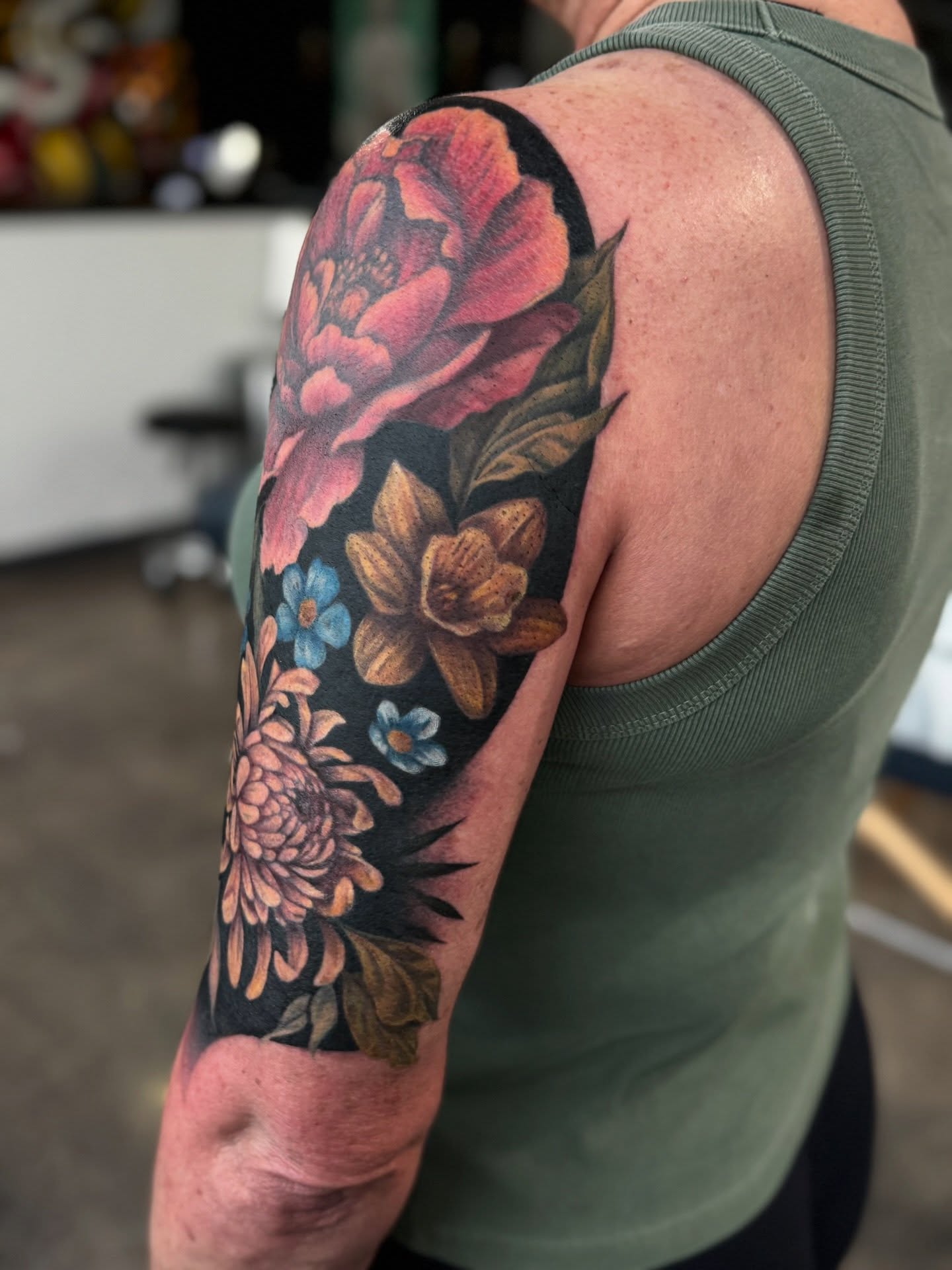 Floral bouquet American traditional tattoo on the upper arm by Glory Pechonis πΏ