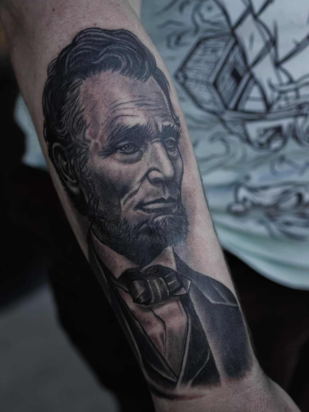 Abraham Lincoln portrait surrealism tattoo on the forearm by Blake Owens, Nashville, Tennessee