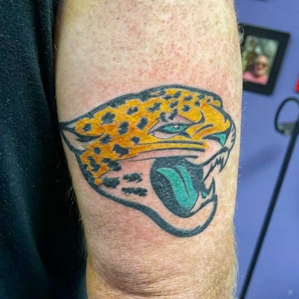 Jaguar head realism tattoo on the forearm by Mark Calloway