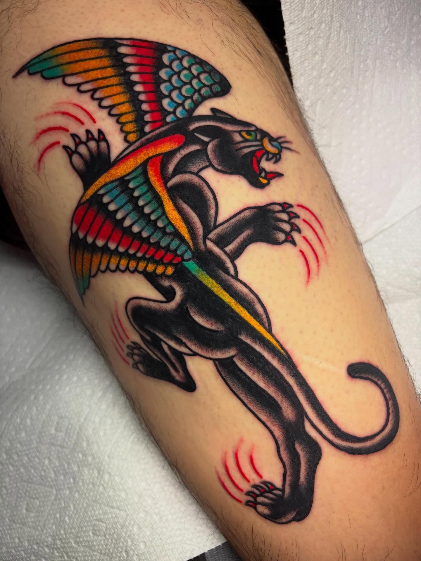 Panther with wings American traditional tattoo on the forearm by Chris Dufresne