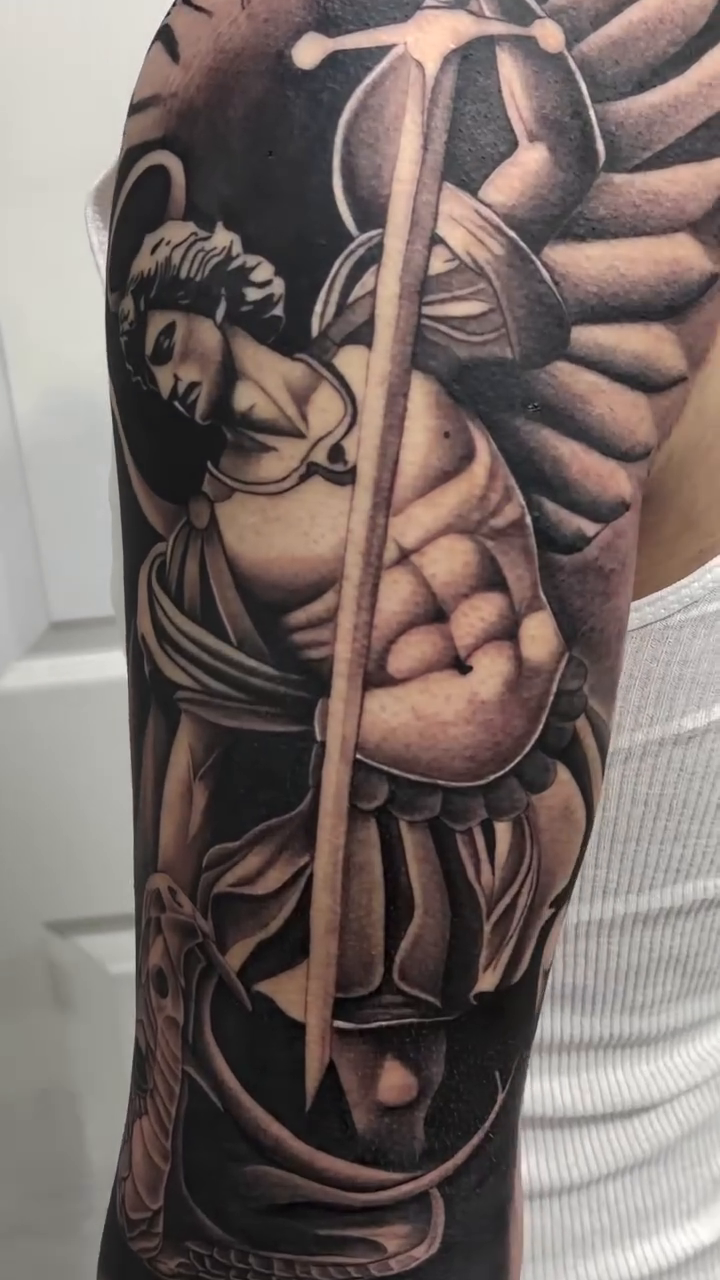 Archangel Michael realism tattoo by caleb coley