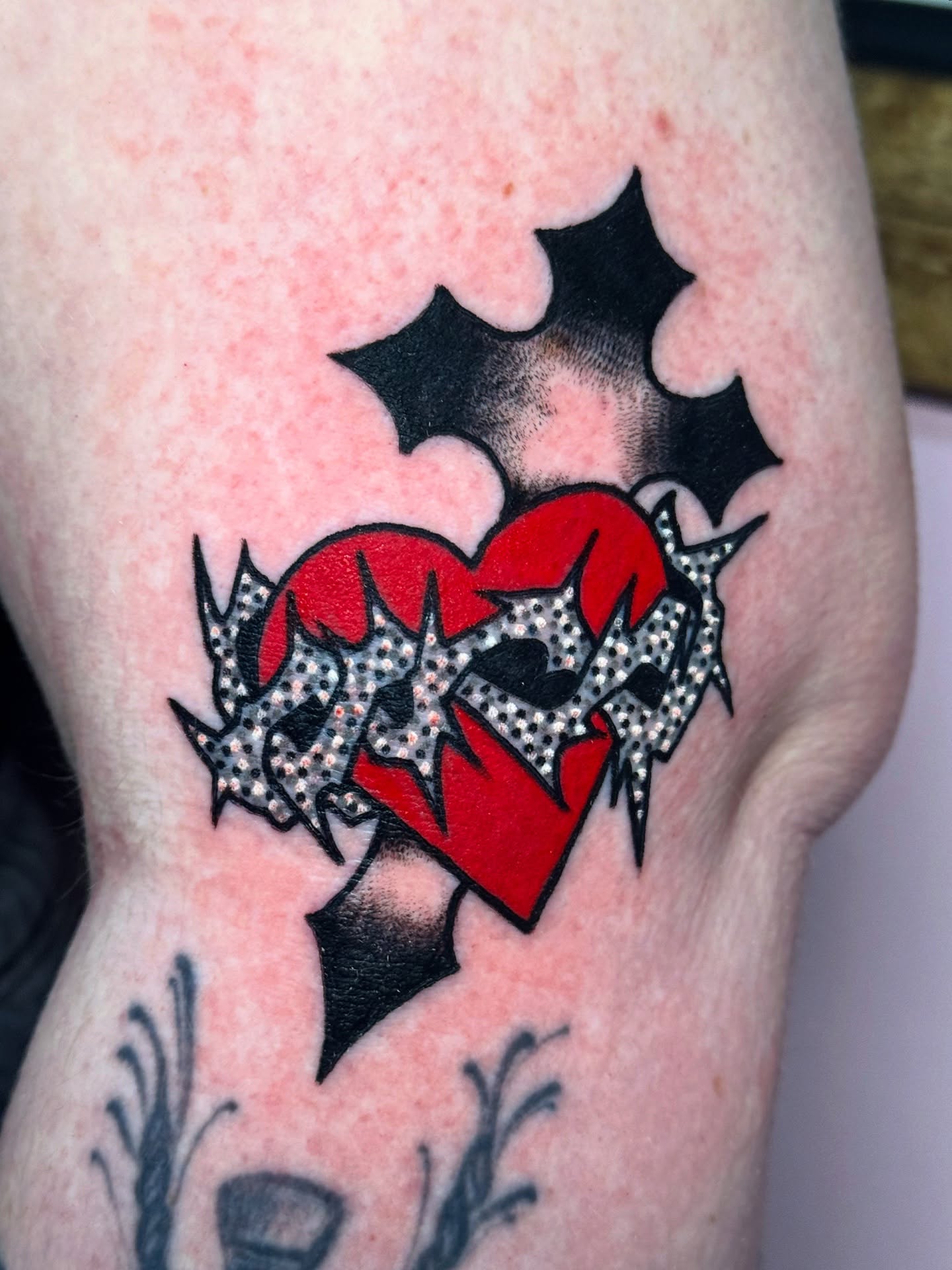 Heart with stars American traditional tattoo on the thigh by Mitch McGarry