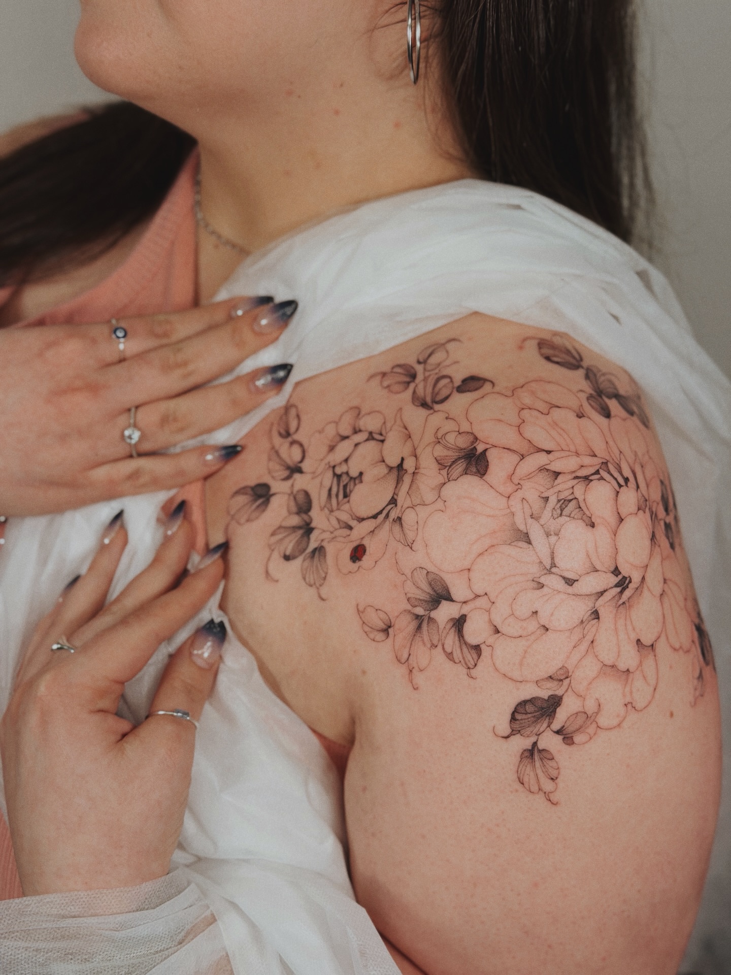 Floral bouquet black and grey tattoo on the shoulder by Andrea Evangelista