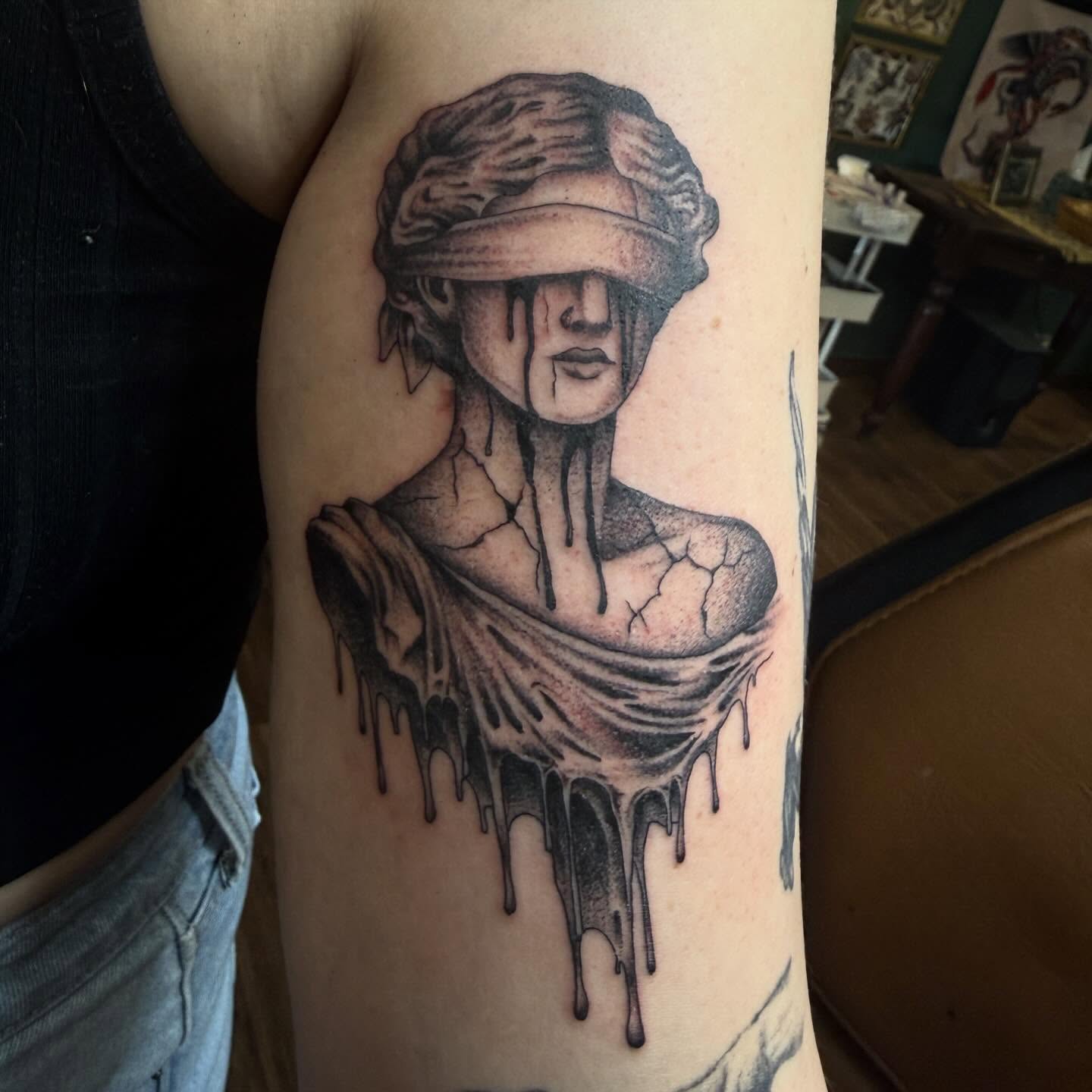 Melting woman realism tattoo on the forearm by Ryan Moraski, Colorado Springs, Colorado