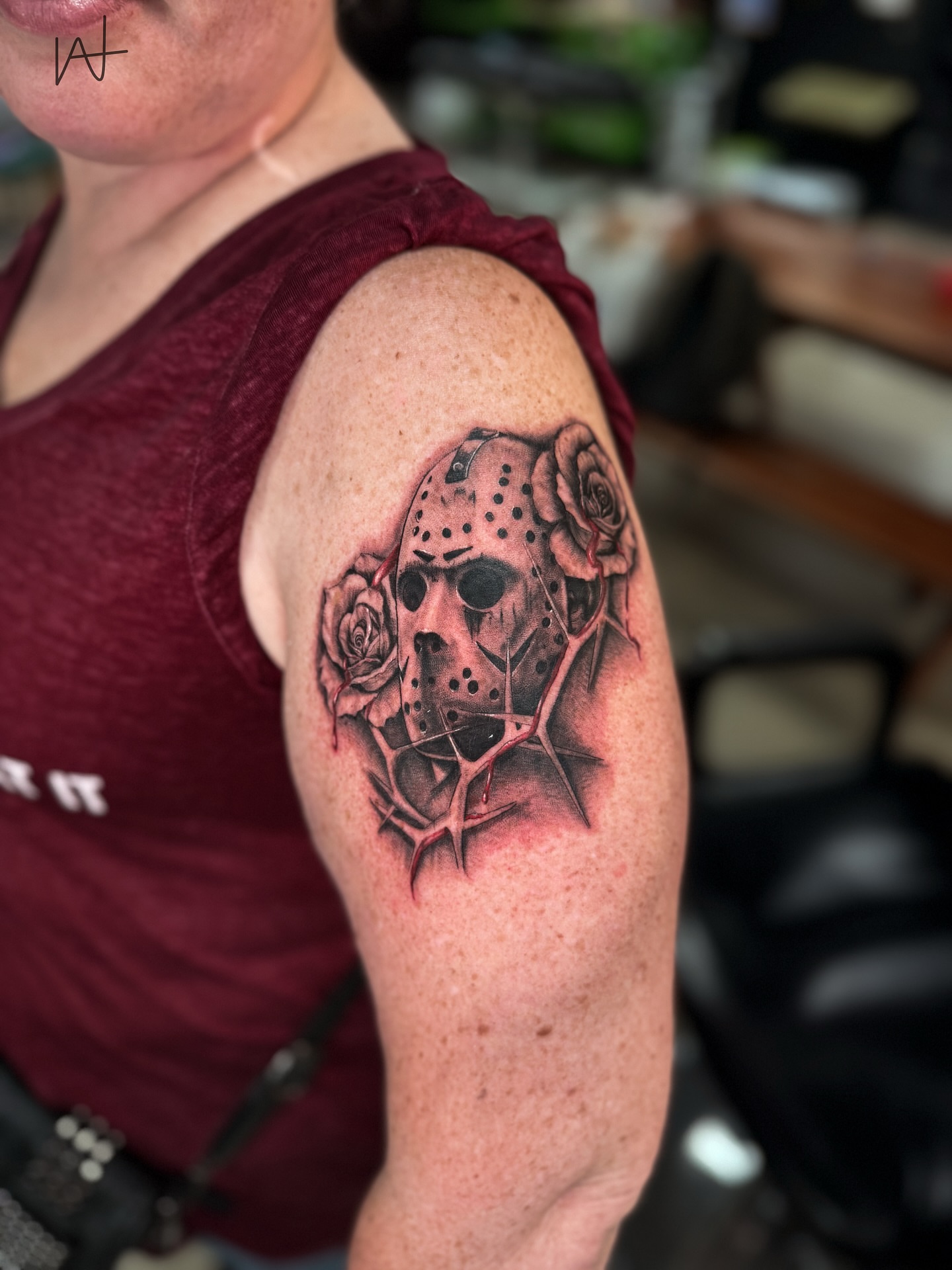 Jason mask with roses realism tattoo on the shoulder by Kat Parmu
