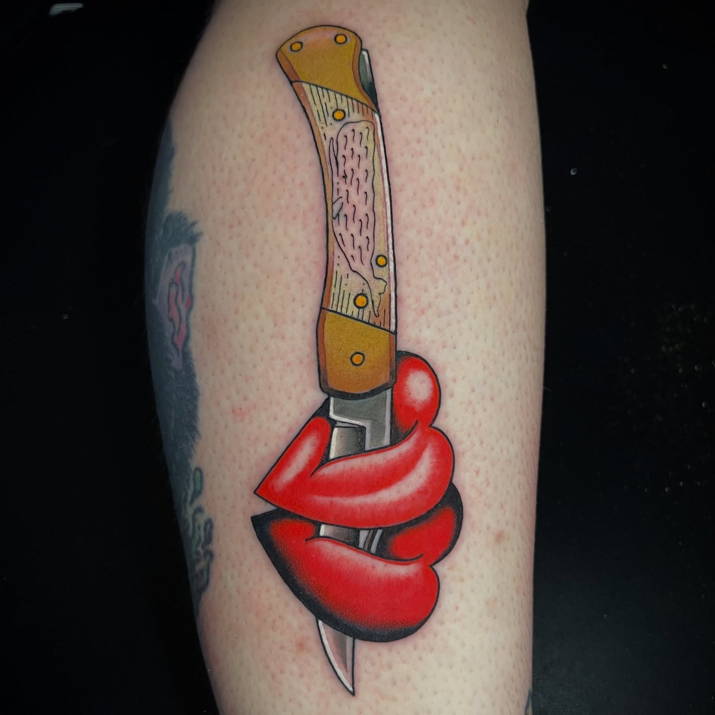Knife and lips American traditional tattoo on the forearm by Michael Munter, Philadelphia, Pennsylvania