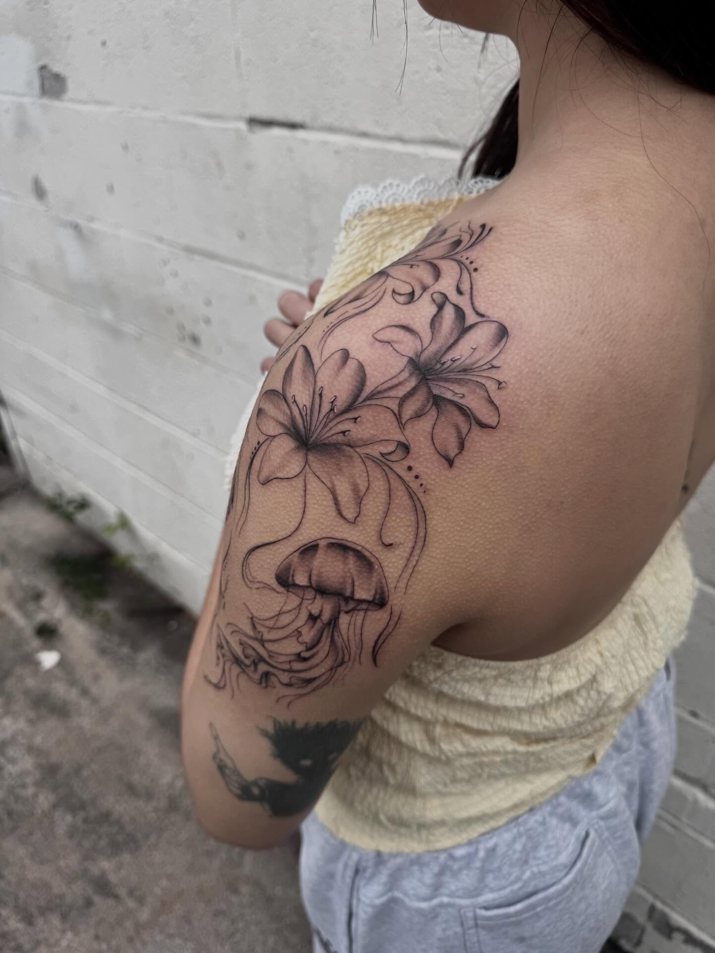 Lilies black and grey tattoo on the shoulder by Priscilla ☾ ⋆*・゚