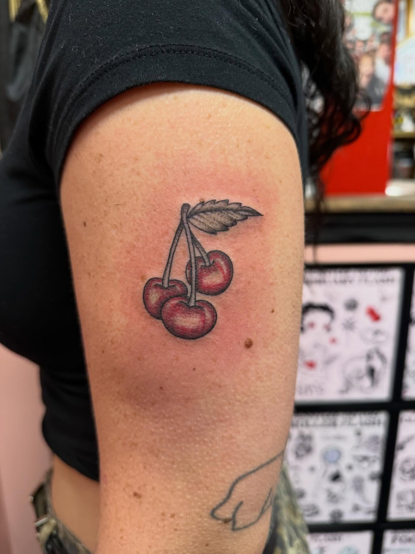 Cherries realism tattoo on the forearm by Jennylee Aerts, Asbury Park, New Jersey