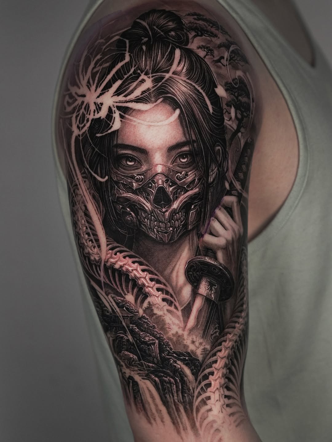 Woman with skull mask and sword Japanese tattoo on the forearm by Sumok Kim